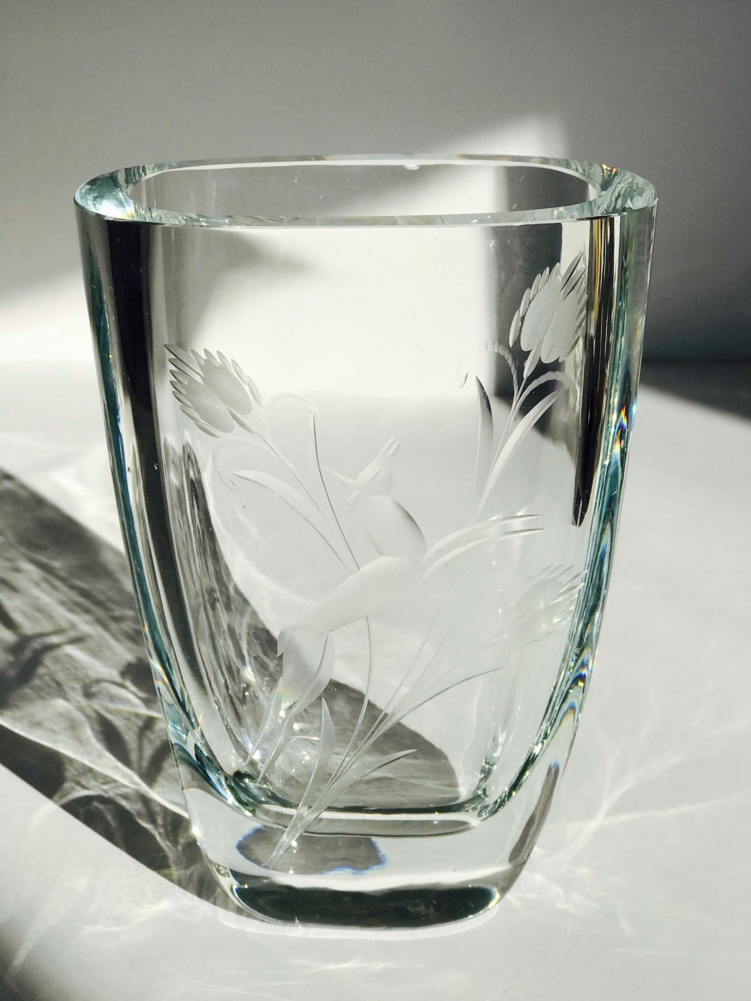 Elegant Swedish Art Deco blown glass vase with thick polished rounded edges and slightly tapered form. Vase has stunning hand etched designs depicting stylized foliage and a leaping doe.