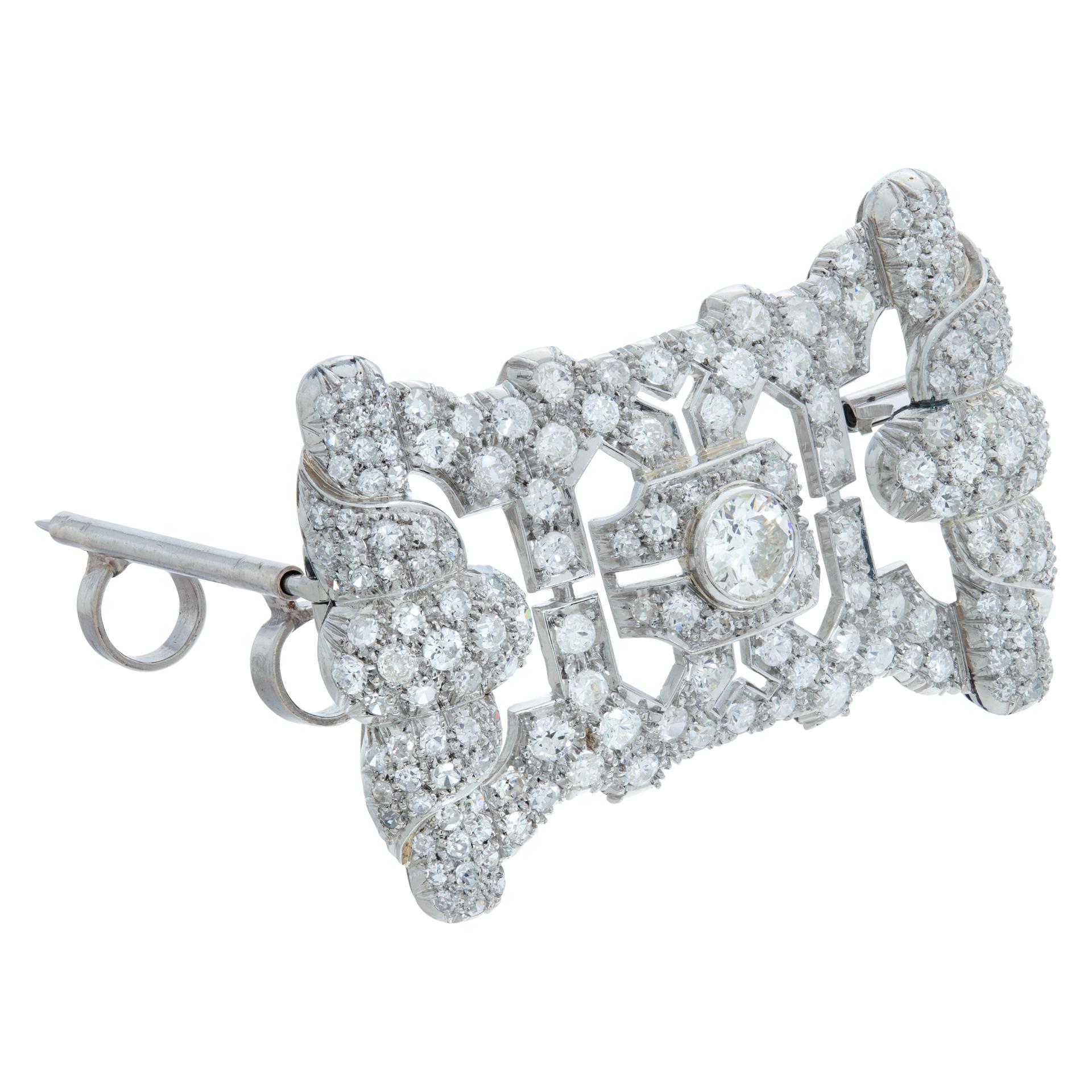 Art Deco & European cut diamonds brooch/pendant in platinum. Total diamonds approx. weight: 5.80 carats, white and eye clean. Measurements:  1.75 inches x 1.25 inches