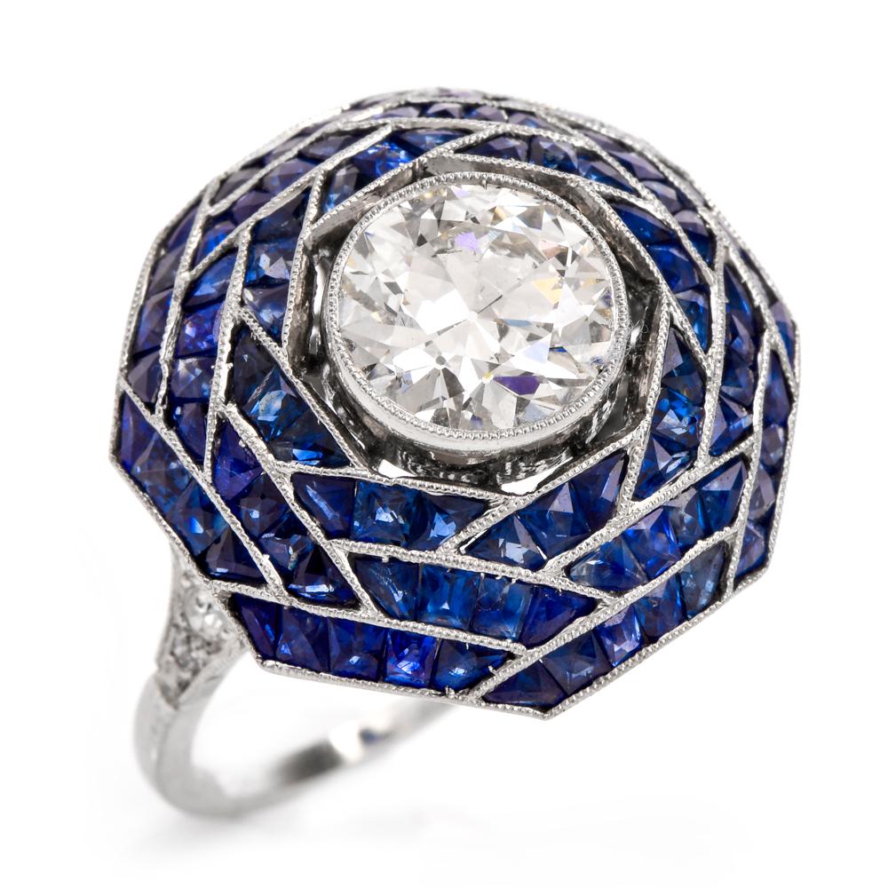 This captivating Art Deco cocktail ring is designed as a gracefully domed octagonal plaque, centered with a prominent approx. 1.80 carat, I color, SI1 clarity European-cut diamond, set within an artfully milli-grained, 'floating' bezel. The