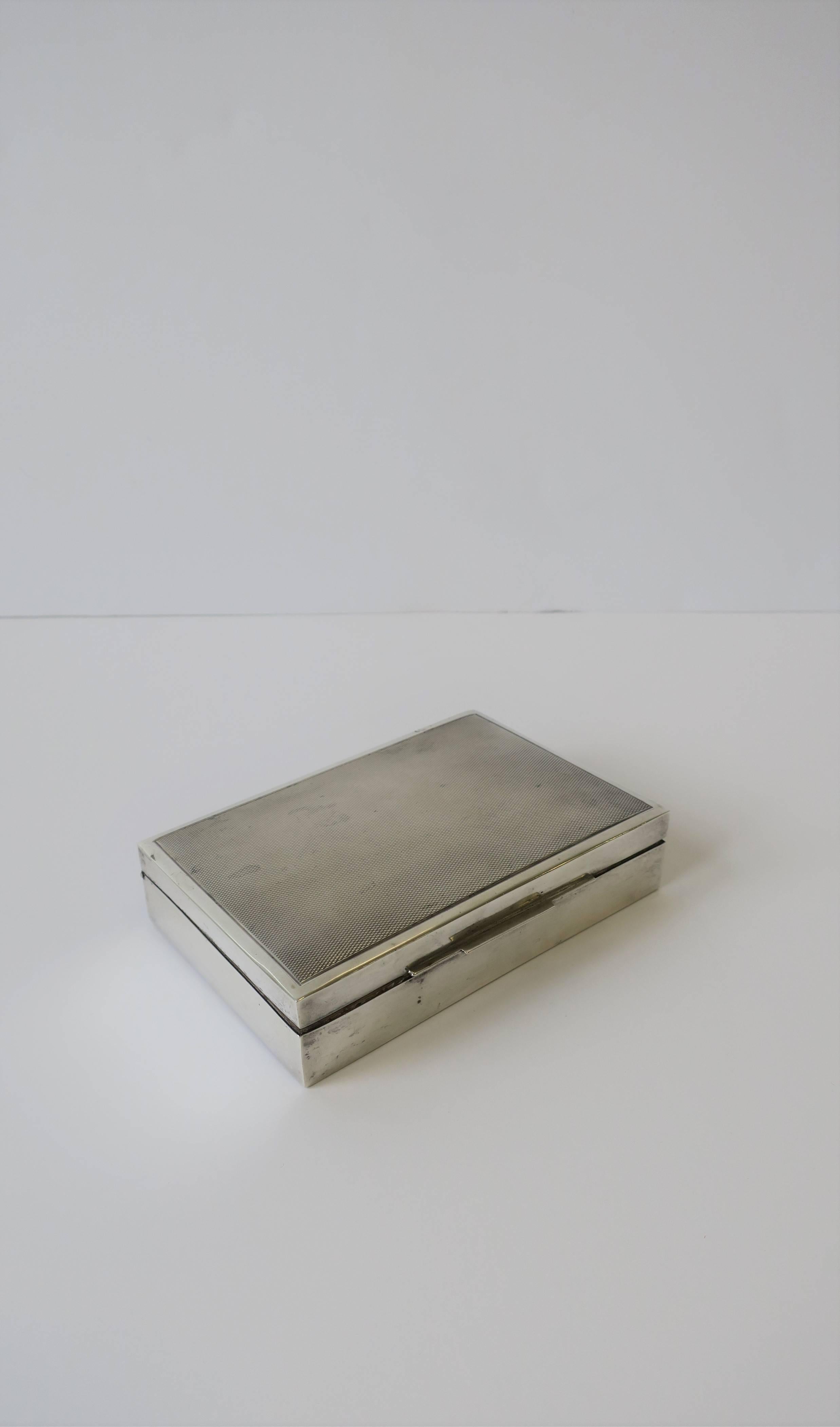 A beautiful German Art Deco period sterling silver box with teak wood lining. Beautiful details on box lid and box lid lift as show in image #3. Box is marked on bottom: '835' for Sterling Silver and 'Handarbiet' (handmade) as show in images #5 and