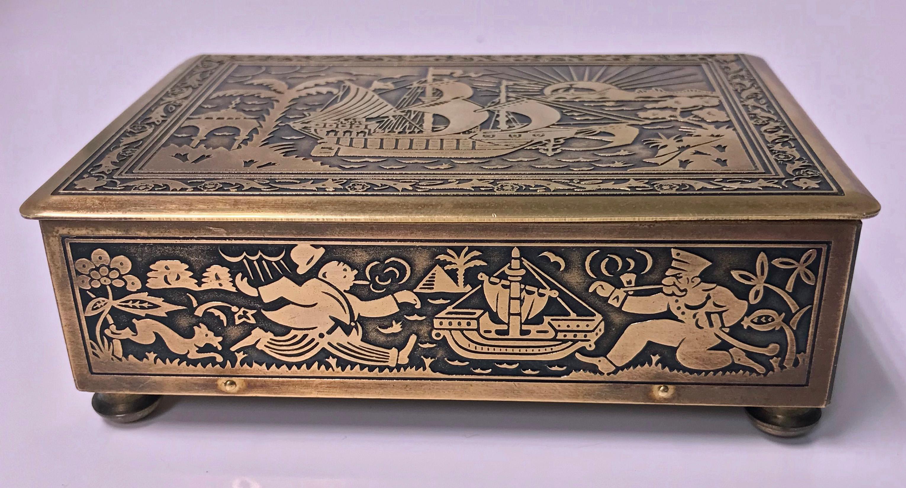 Art Deco brass Jewelry box, Germany, circa 1920 possibly by Erhard & Söhne of Schwäbisch Gmünd. The box of rectangular shape on brass bun feet, the brass body and cover oxidized inlay decorated with various scenes of running figures, animals, sunset