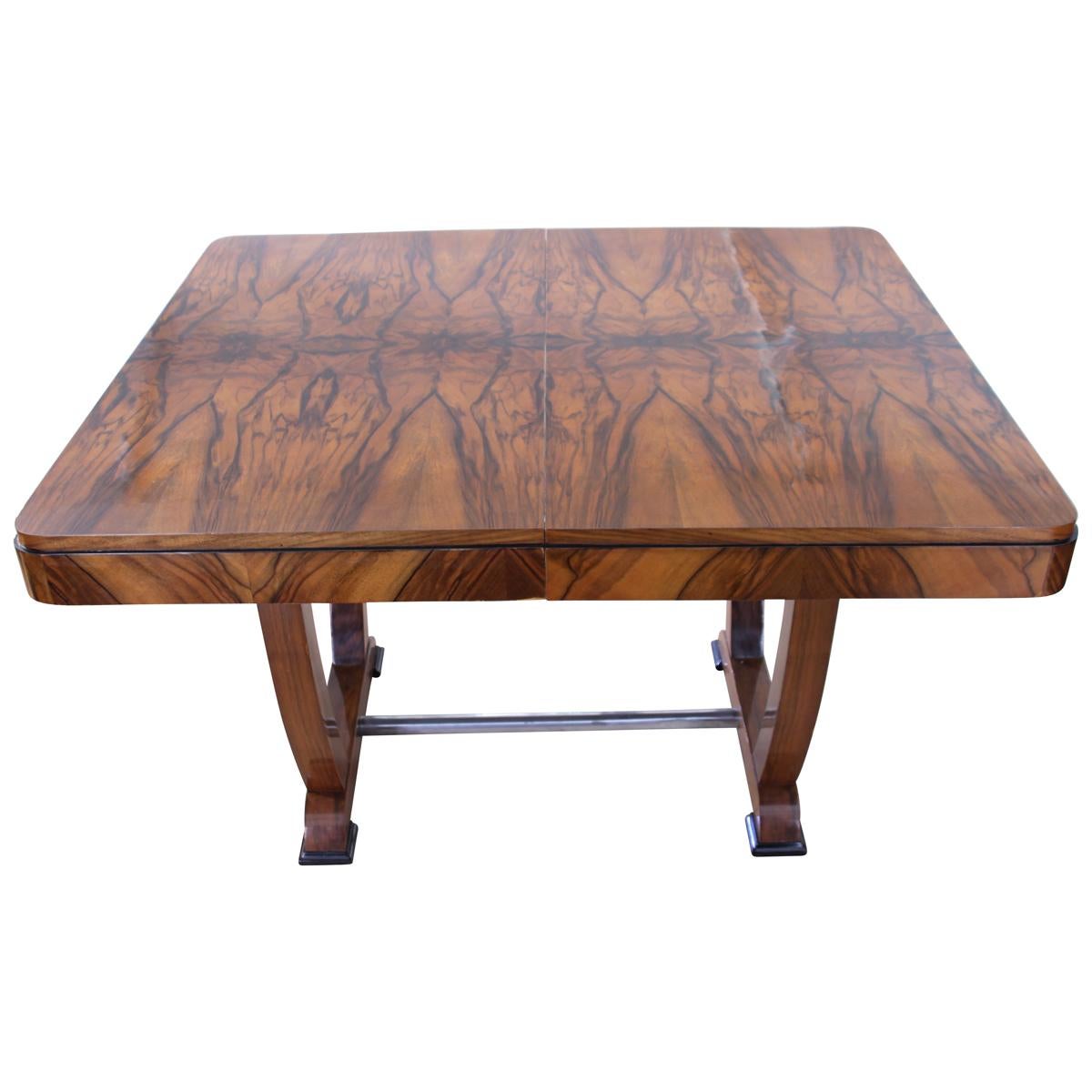 Expandable Art Deco Dining Room Table in Walnut Veneer from France circa 1930.

The table has a stunnin book-matched walnut veneer on the plates, that has been finely hand-polished with shellac (French polished). 
The sides of the plate and the leg