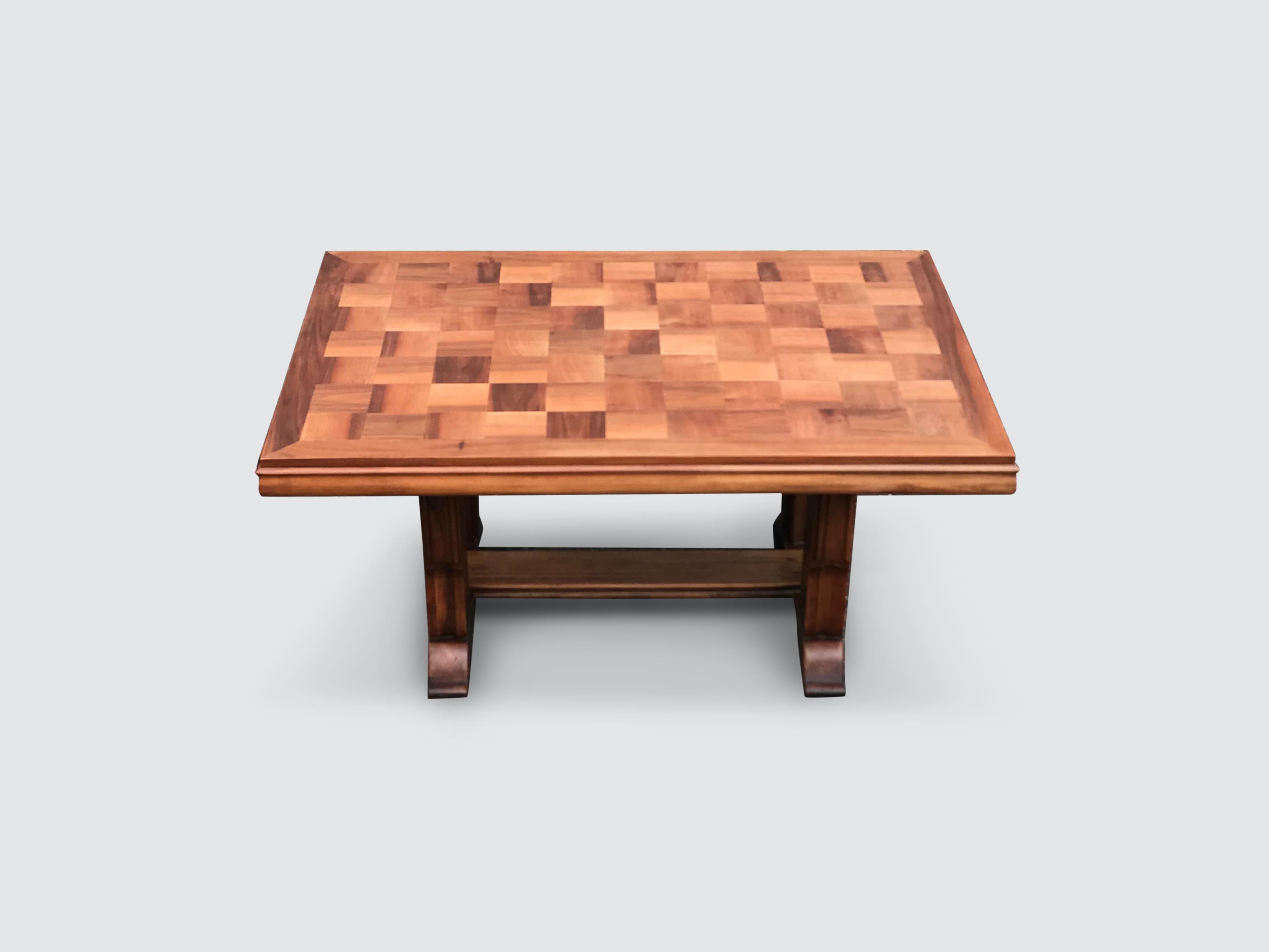 Extendable dining table attributed to Gaston Poisson in light oak and checkered board patterned top.

The dining table has been fashioned by hand in typical art-deco or art-nouveau French style with the sculpted legs, curled feet and patterned