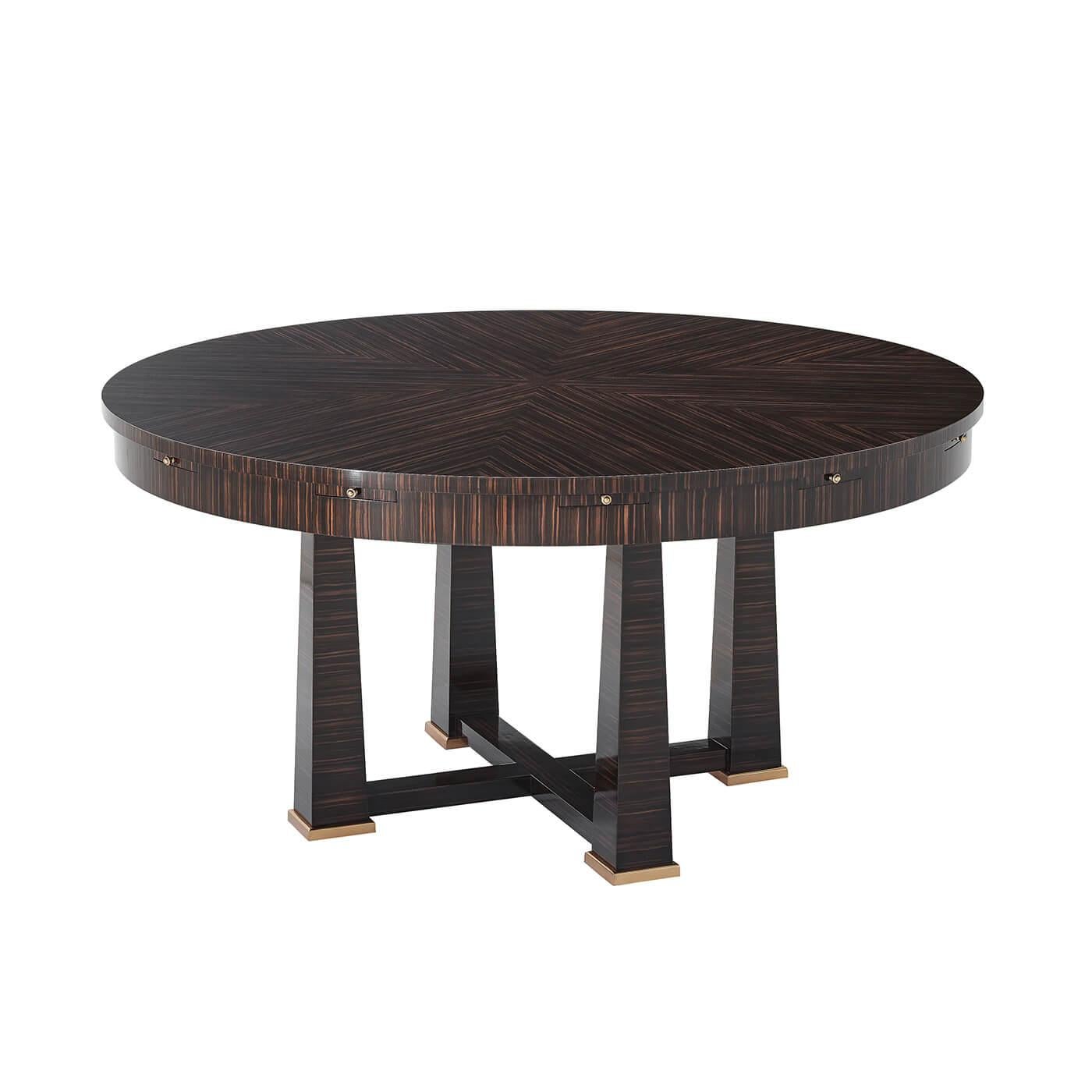 A European Art Deco inspired center table with striking sunburst Amara veneered top with Amara finish expanding with six radial leaves. The pedestal is a series of four square reversed tapered legs joined by an X-stretcher. Hampton brass finish