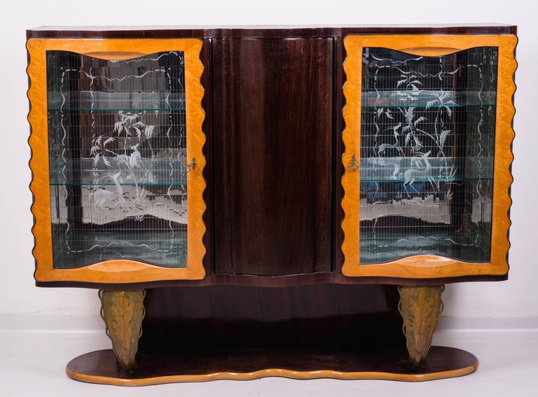 Masterpiece of the famous Italian designer Pier Luigi Colli.

 The same set is available the table, six chairs and the sideboard with the mirror.