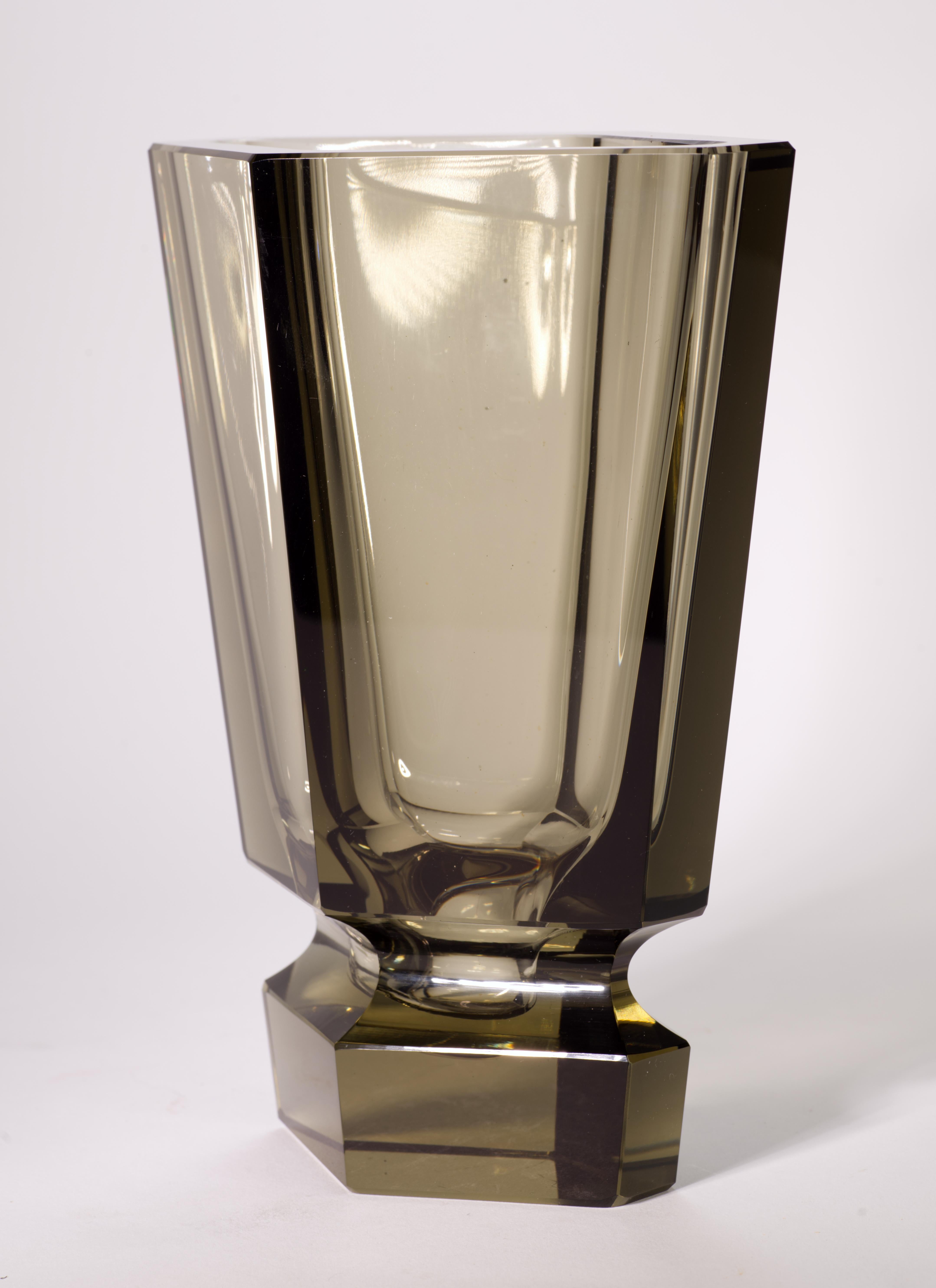  Sculptural Art Deco vase was made of heavy crystal glass in smoky topaz or Anthracite color, featuring bold, faceted cut sides in the Viennese Secessionist style of Josef Hoffman. Hoffman, a prolific and talented artist, created similar pieces for