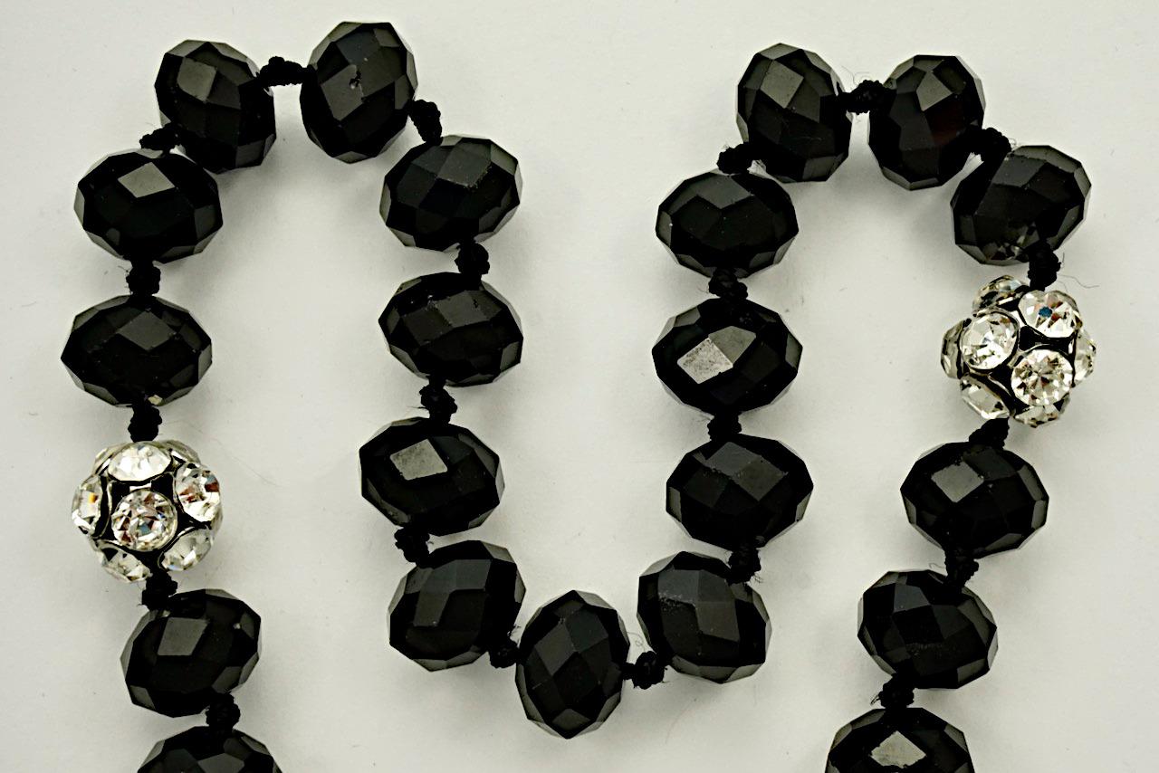 
Fabulous Art Deco faceted french jet bead necklace with rhinestone ball beads. The necklace is knotted between each bead. Measuring length approximately 132 cm / 52 inches. The necklace is all original and in very good condition. There is some wear
