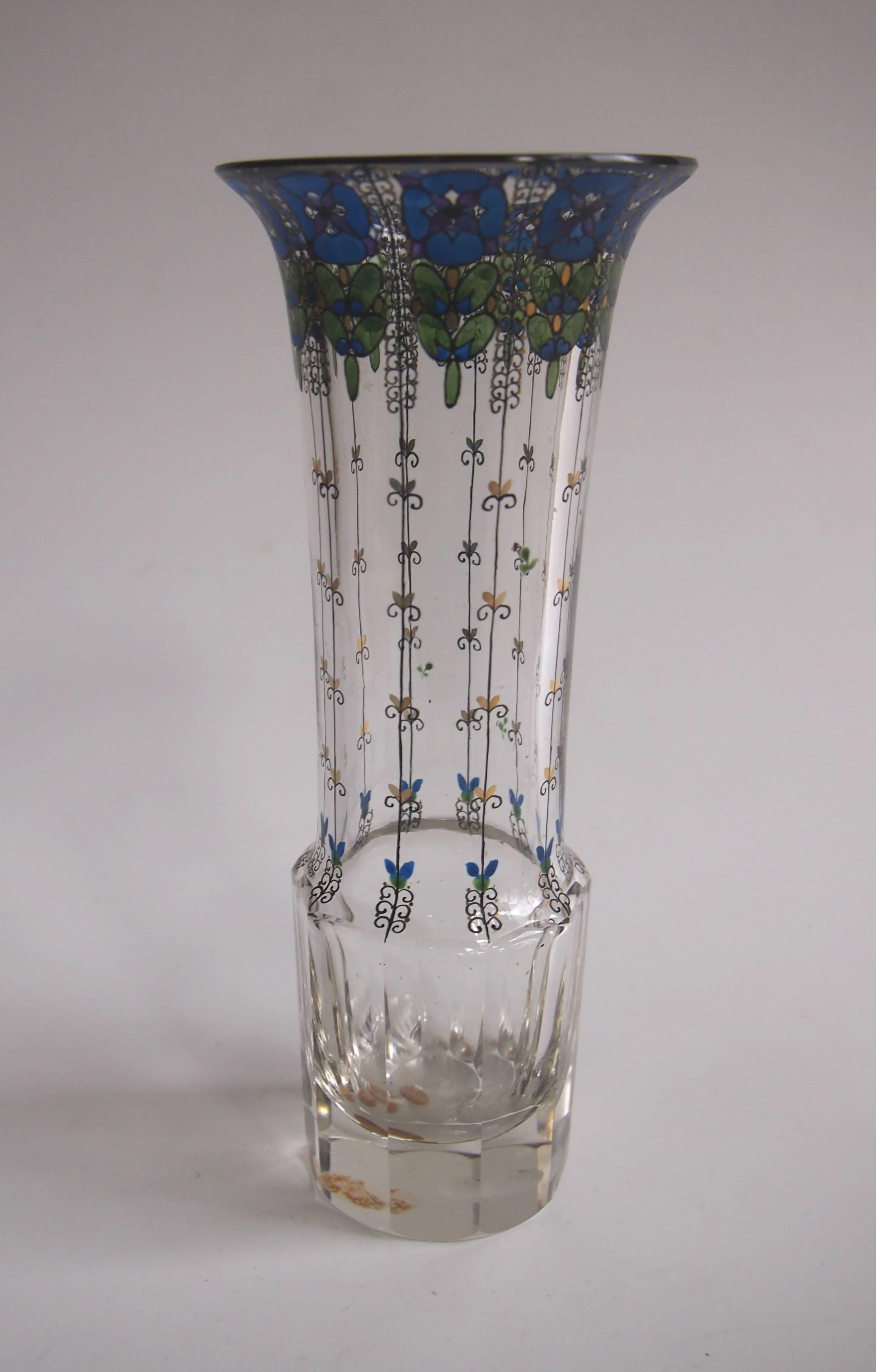 Cute gilded and enamel Haida flared top vase with black green and blue decoration draping down the vase and the original factory label to the base (see image 7)

Haida, now known as Novy Bor, was one of the greatest bohemian glass schools of all