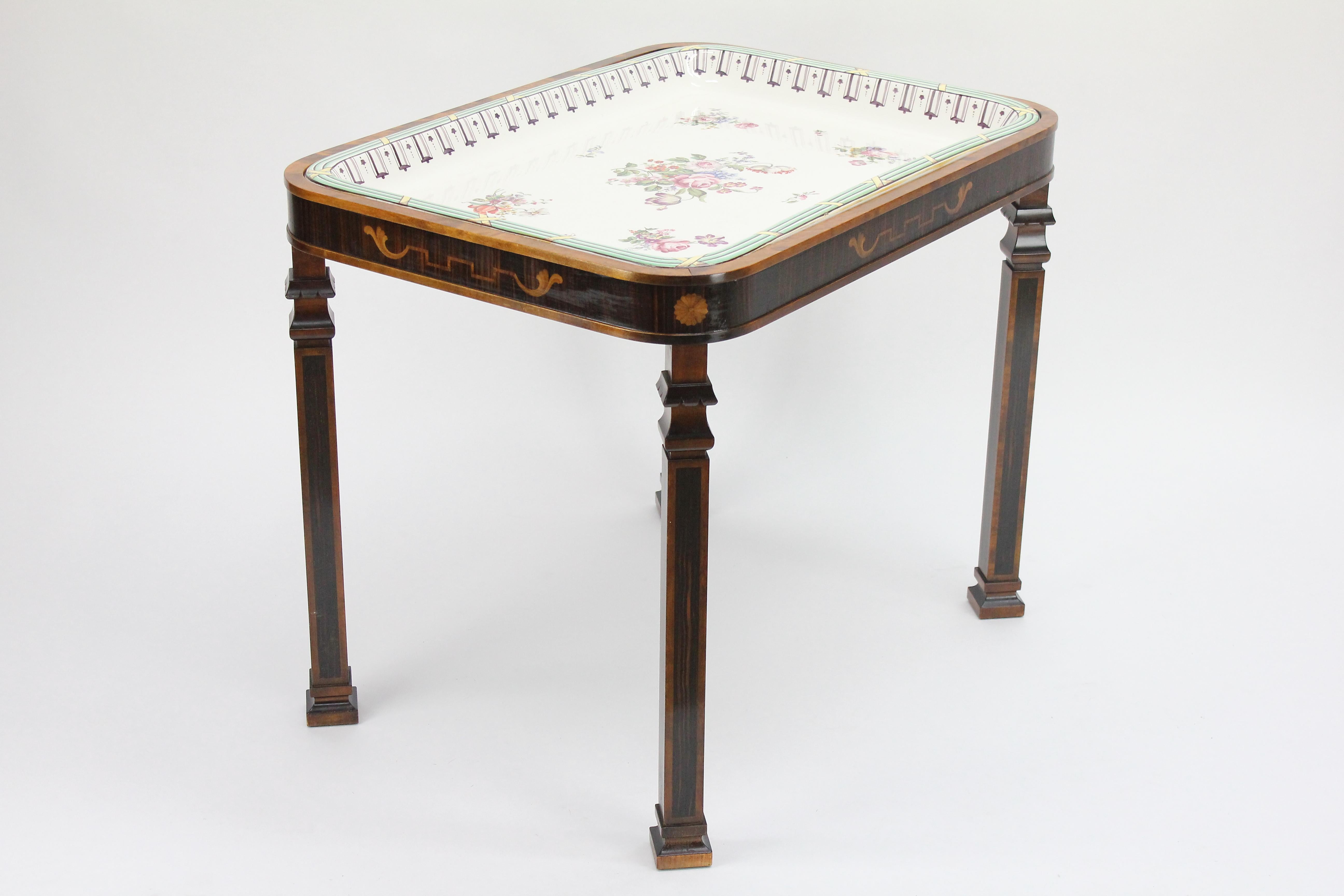 Vey unusual Swedish Grace tray table. Most likely Carl Malmsten for Bodafors, 1920s.
The hand-painted faience tray is made by Karl Lindström (1865-1936) for Rörstrand, Stockholm Sweden.
Signed with Rörstrands crowned 