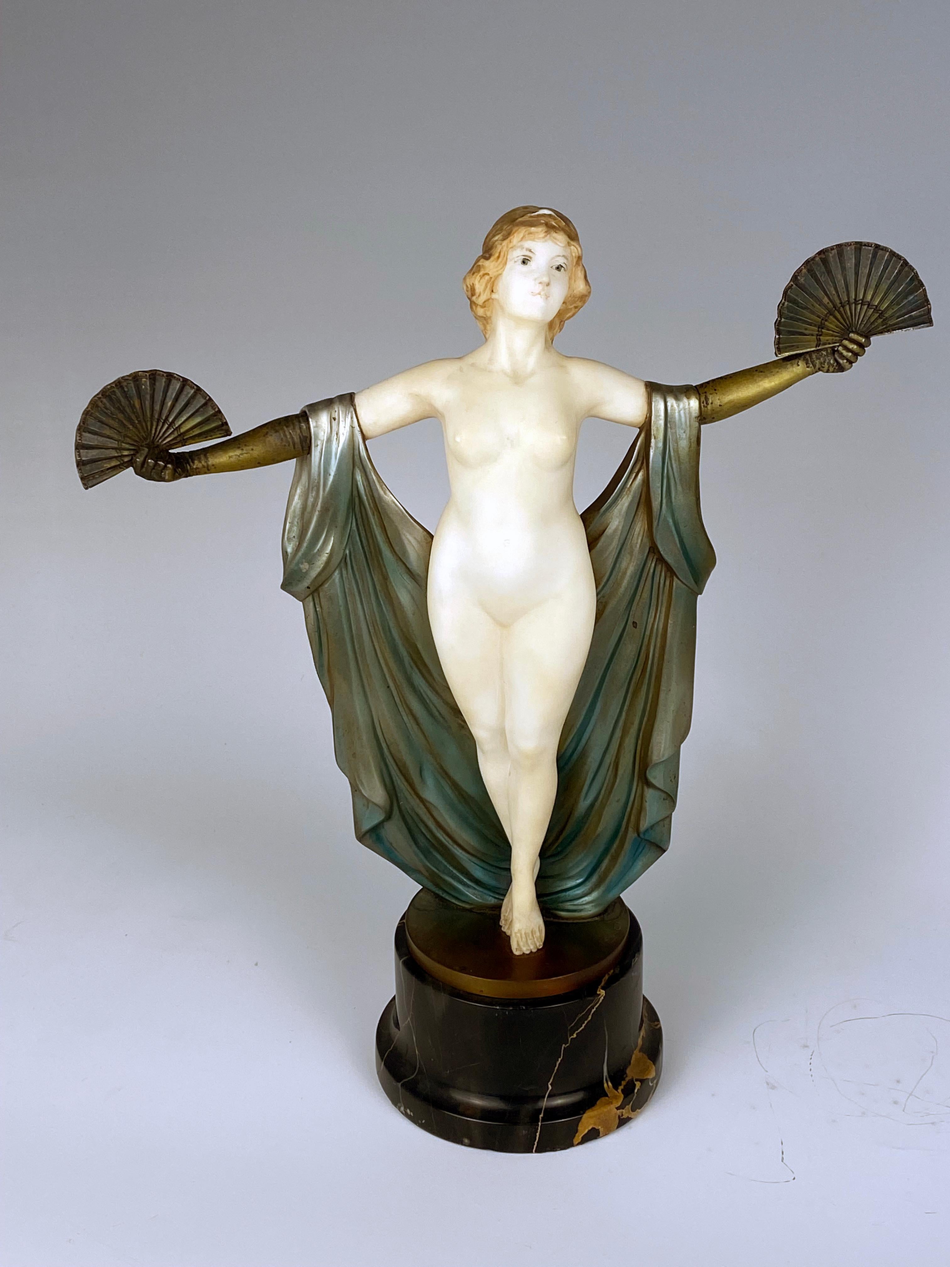 Art Deco sculpture made of carved white marble and casted bronze depicting a female dancing with fans.
Made in France
Circa: 1920
Signature: Suteur.