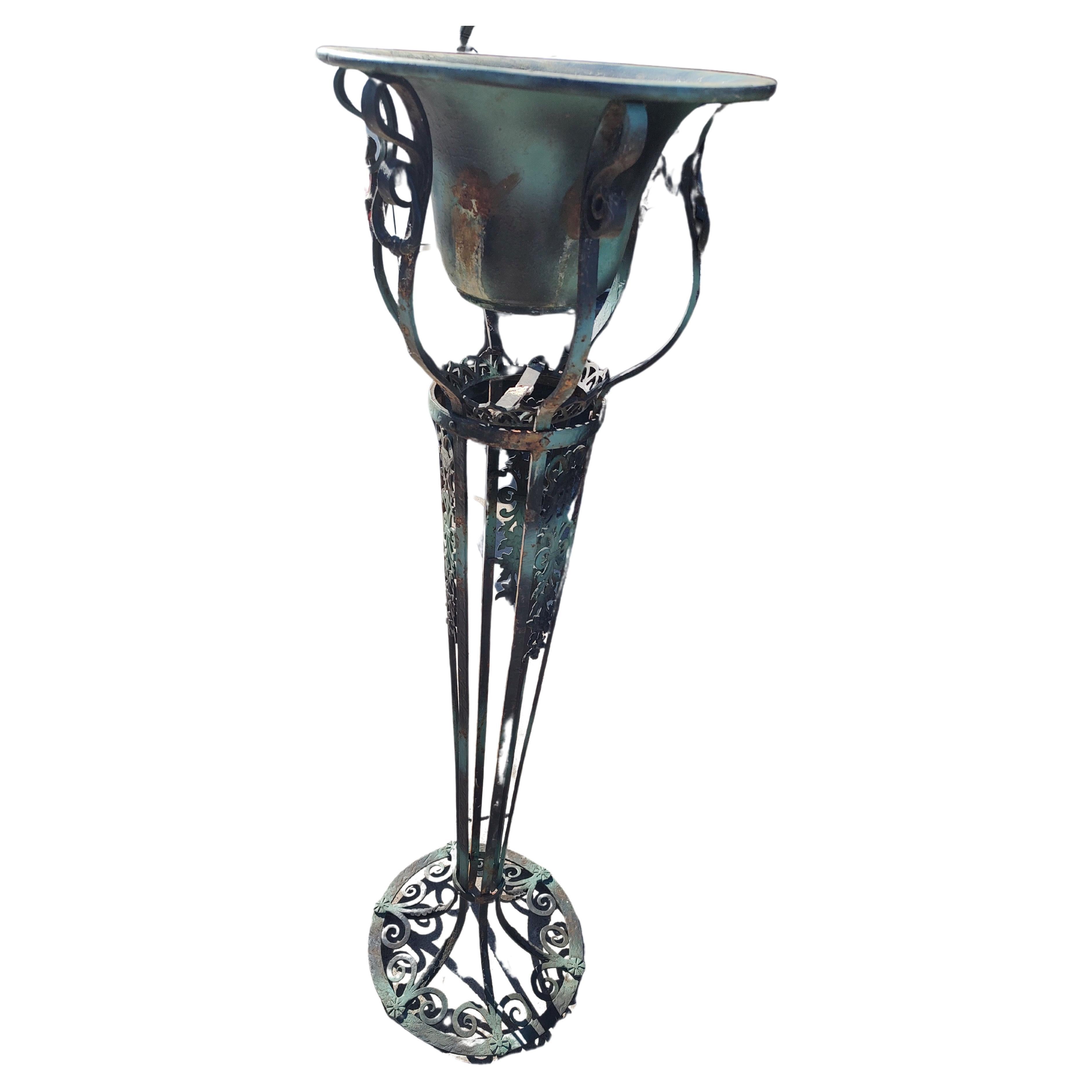Fantastic and tall iron with copper pot plant stand. Almost 5ft tall with a base of 17inches this stand stands alone or almost. It's grande in its appearance and with its adornment this piece is set apart from the others.. High Quality and excellent
