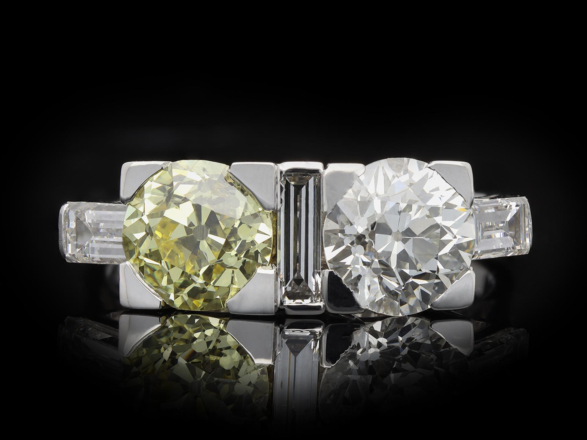 Women's or Men's Art Deco Fancy Light Yellow Diamond Two Stone Ring by Gubelin, circa 1920 For Sale