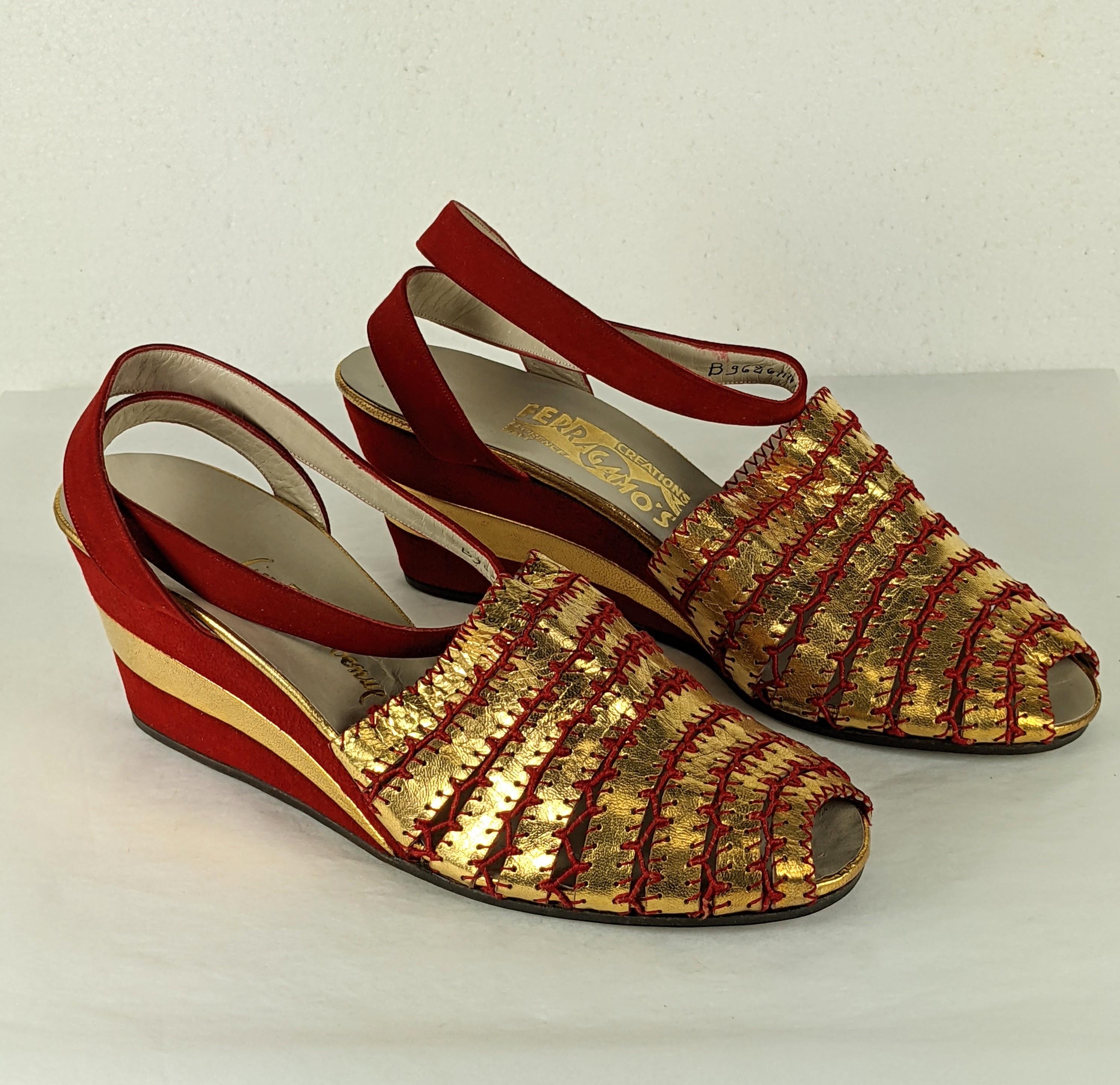Art Deco Ferragamo Gold Kid and Red Suede Wedges, rare unworn old stock. Strips of gold kid incredibly hand stitched and hand crochet with red cotton cord, the wedges covered with red suede spliced with gold kid. 1930's Italy. 
Original sale price