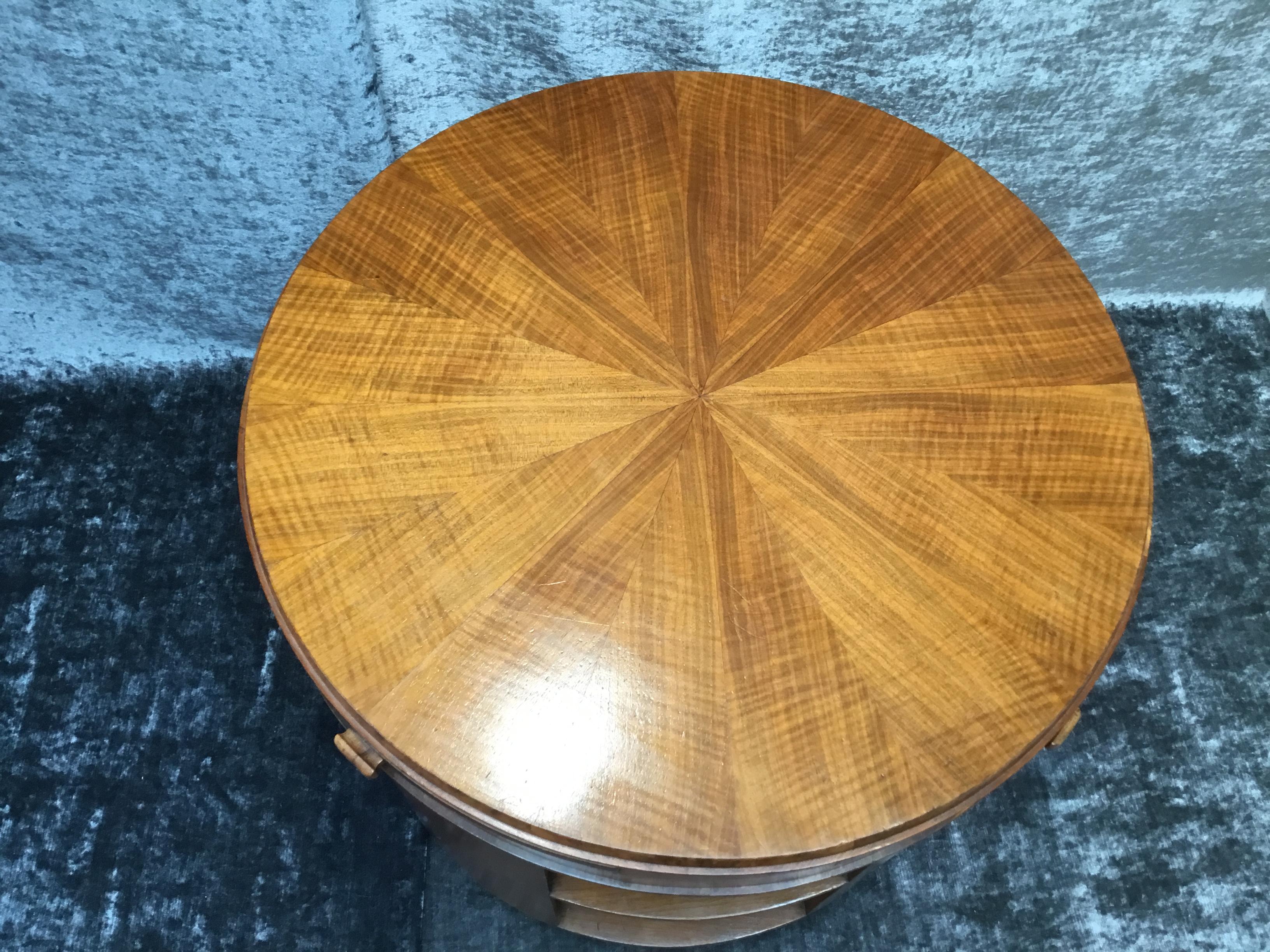 Art Deco round table with four pullout / pull-out shelves and storage shelves beneath. 
The fiddle backed maple used in this table is a striking contrast to the bird's-eye maple, used for the pullout / pull-out shelves. The table has its orginal