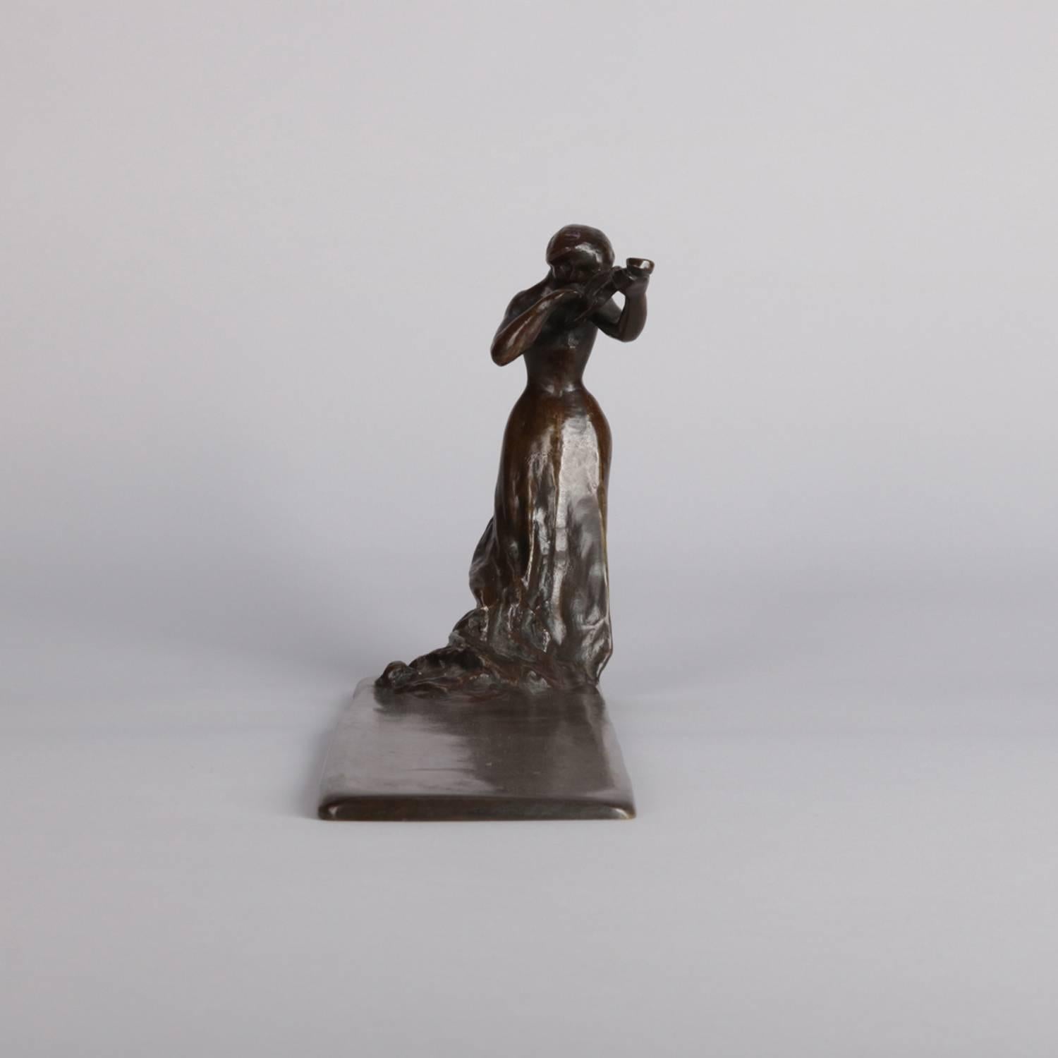 Art Deco figural bronze sculpture desk or dresser tray features full length portrait of female violinist in orchestra attire standing before extended tray, 20th century

Measures: 6.25