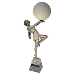  Art Deco figural Holding a Globe Table Lamp by Fabrication Francaise Paris