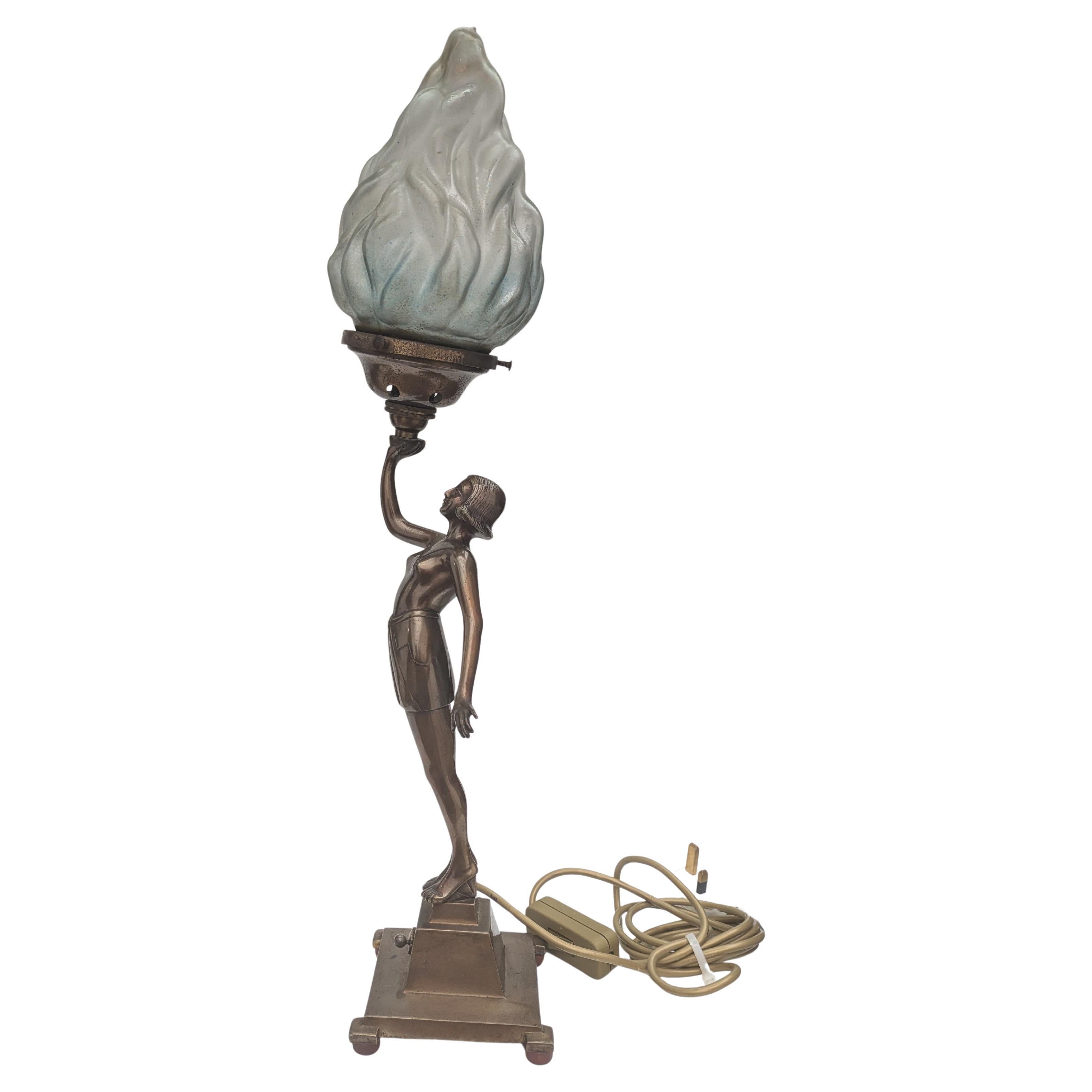 For your consideration is this rare English Figural table lamp. Originally these lamps were created to stand on the end banister of a staircase, how glamorous! These lamps are relatively rare to find & most of not all have been converted to be a