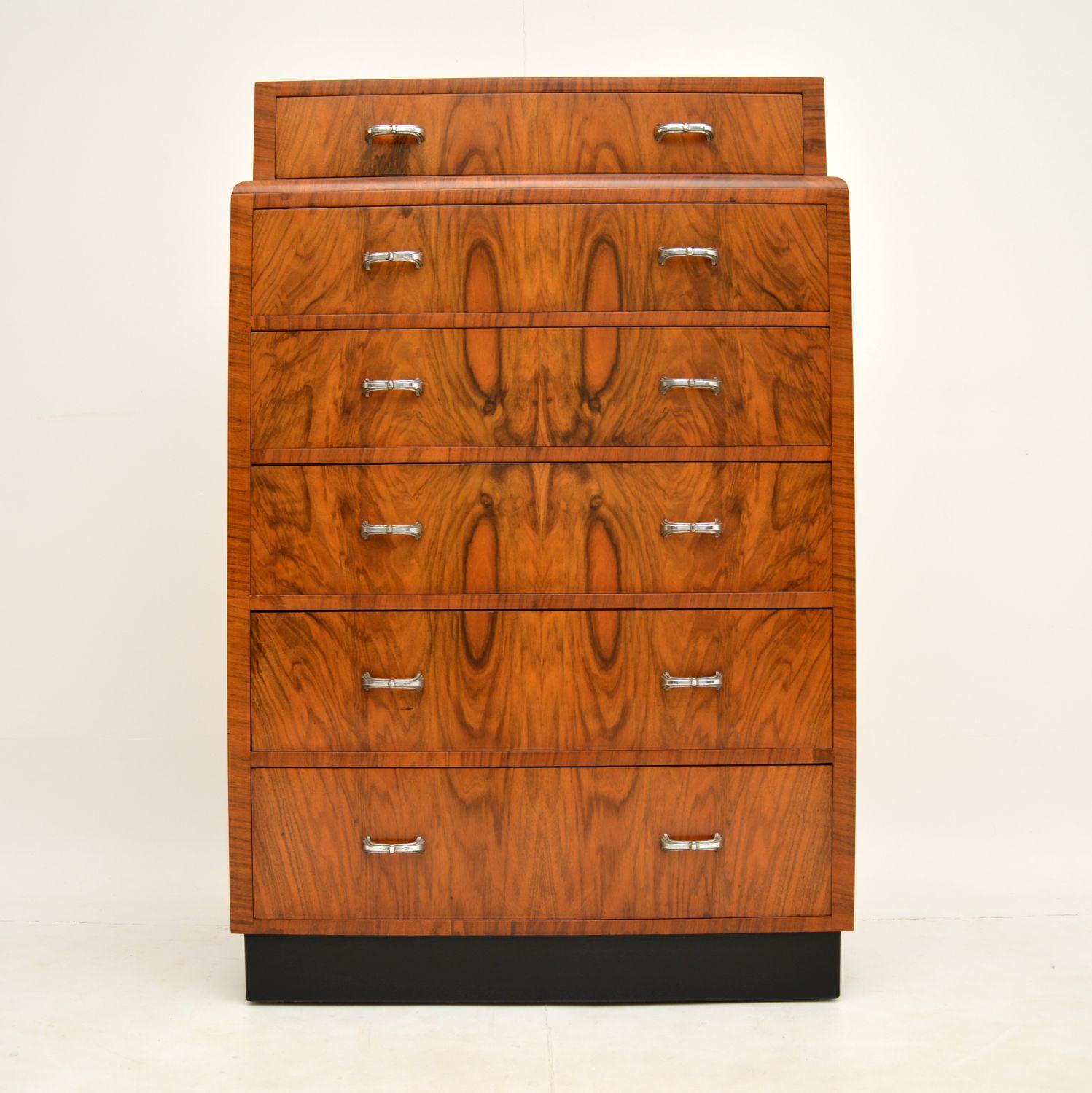 A stunning vintage Art Deco period chest of drawers in walnut. This dates from the 1930’s.

It is of amazing quality, with solid wood construction and absolutely beautiful figured walnut veneers. This has the original chrome handles, and a lovely