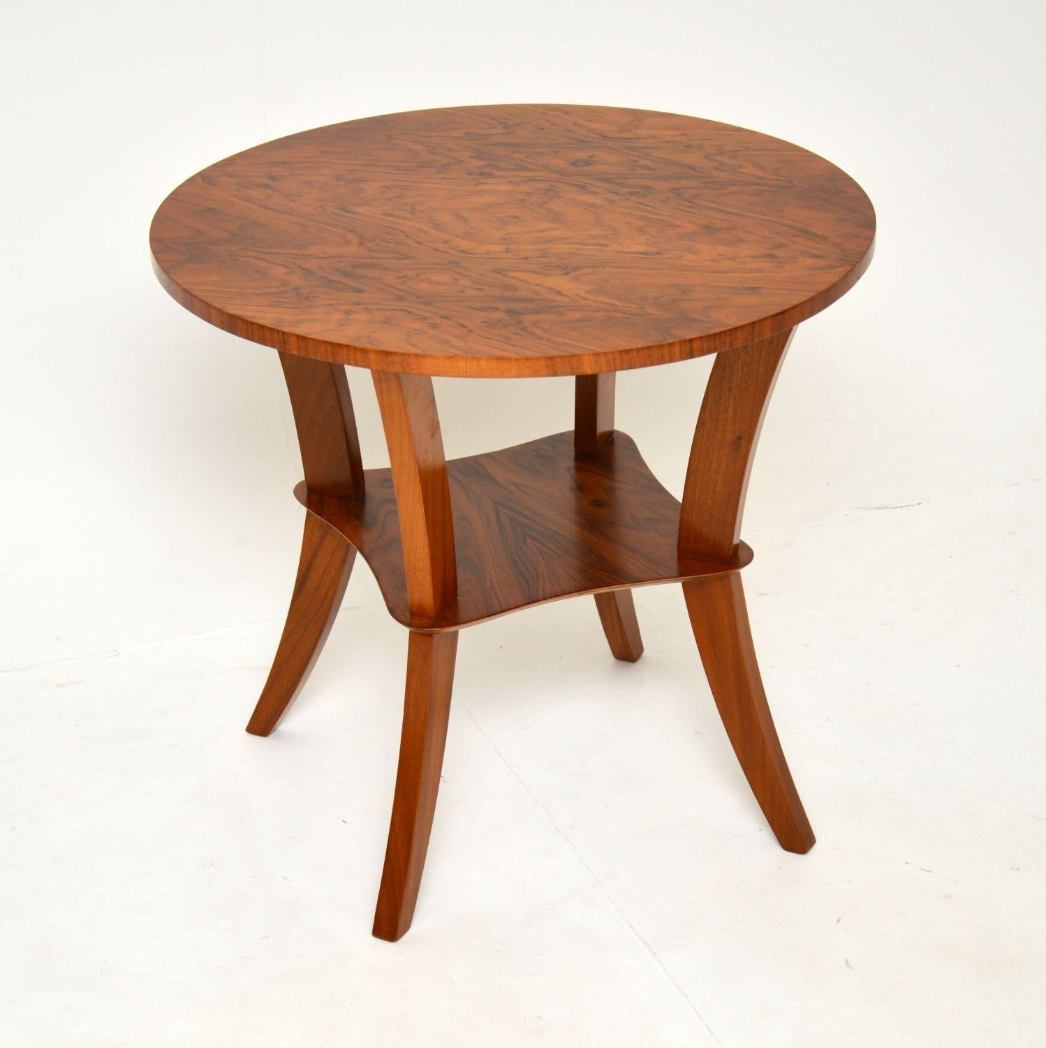 A beautiful and elegant original Art Deco period occasional table in walnut. This was made in England it dates from the 1930’s.

It is a great size to be used as a coffee table or a side table, the design is gorgeous and the quality is