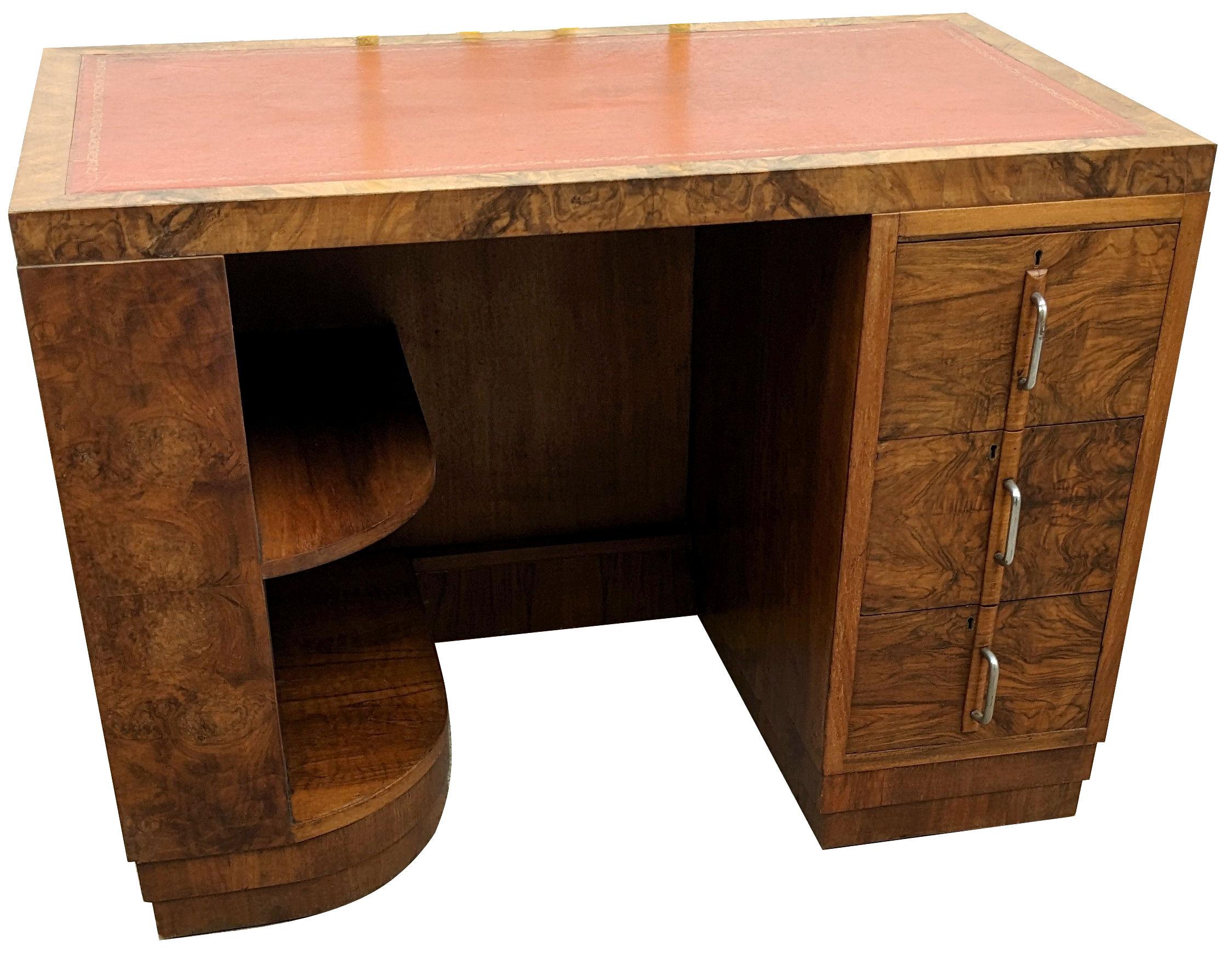 For your consideration is this exceptional Art Deco English walnut desk of good proportions and dating to the 1930's. A high level of craftsmanship and materials used is evident through out. Fabulous shape and styling will so easily integrate with