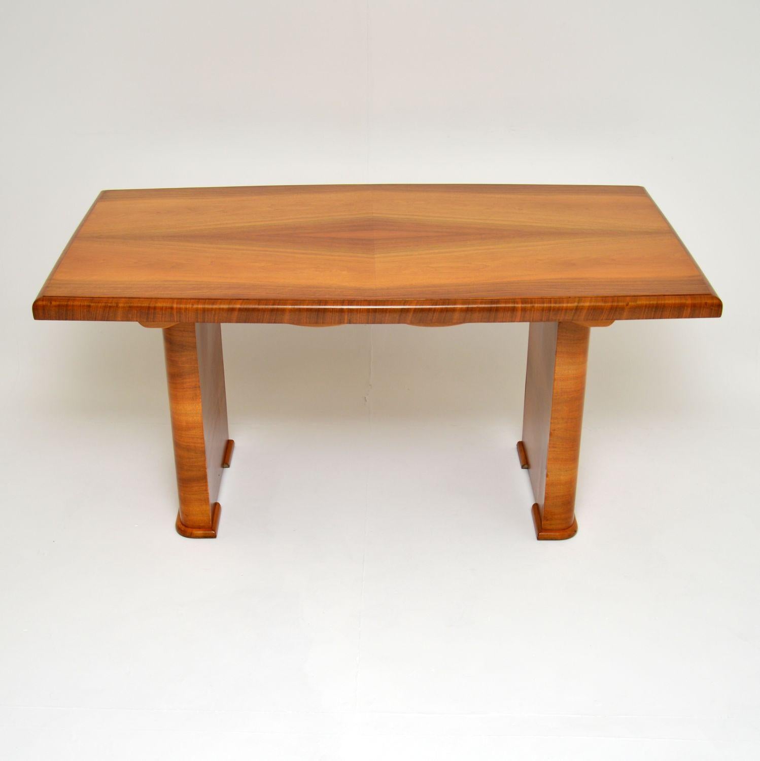 A wonderful original Art Deco period dining table in walnut. This was made in England, it dates from the 1930’s.

It is of wonderful quality and is a very useful size. It would be equally useful as a dining table or a desk. The top has a lovely