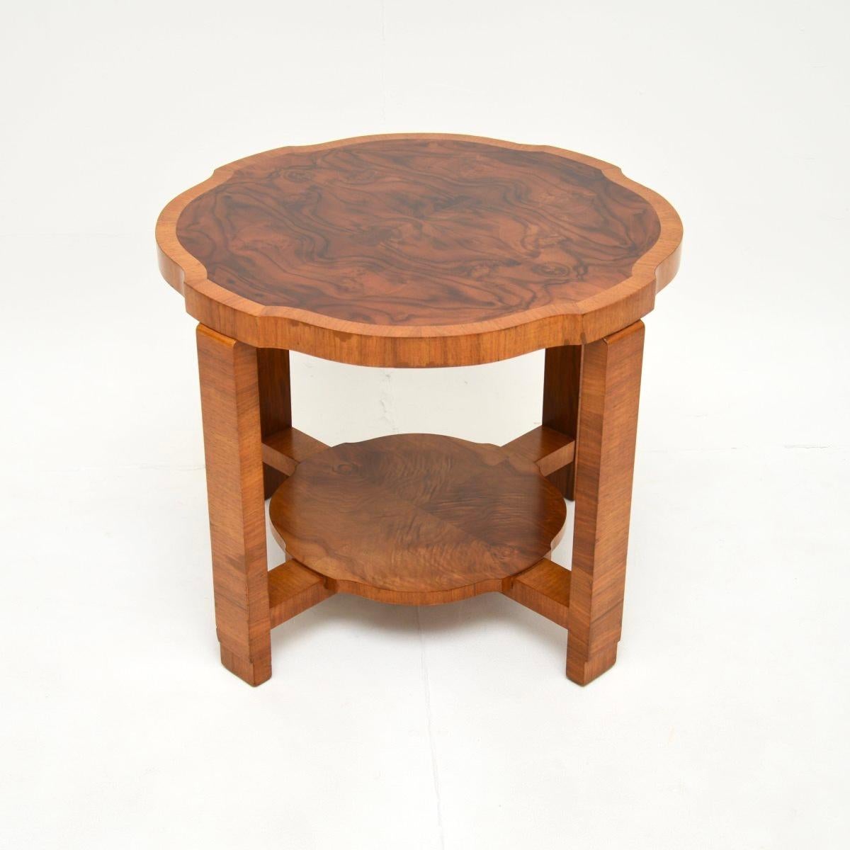A stunning original Art Deco figured walnut occasional / coffee table. This was made in England, it dates from the 1930’s.

It is of lovely quality and has a beautiful design. The circular top is slightly serpentine in shape on the edges, with
