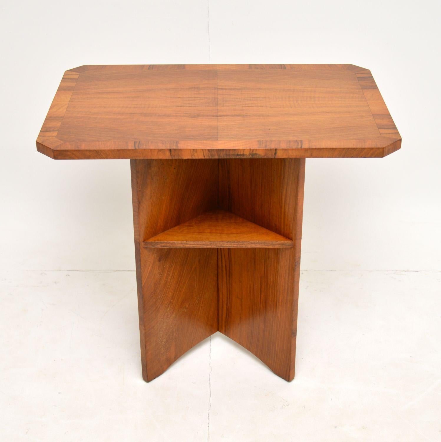 A beautiful and interesting original vintage Art Deco period side / coffee table in walnut. This was made in England, it dates from the 1930’s.

The quality is excellent and this has a lovely design. The top is cross banded, and the lower section