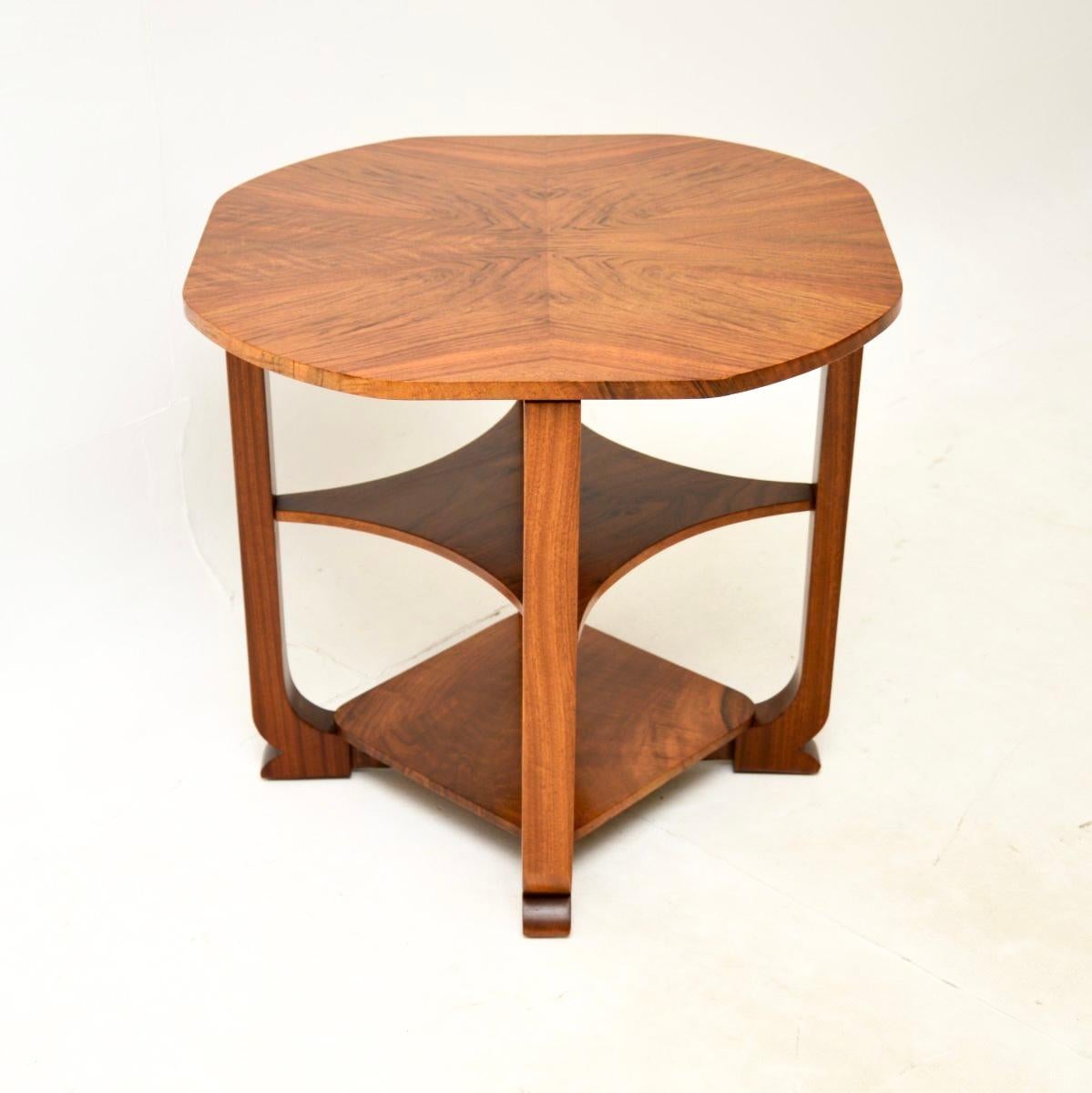 A stylish and extremely well made Art Deco figured walnut occasional side table. This was made in England, it dates from the 1920-30’s.

The quality is superb, this has a beautifully shaped top and an additional two useful lower tiers. The top has a