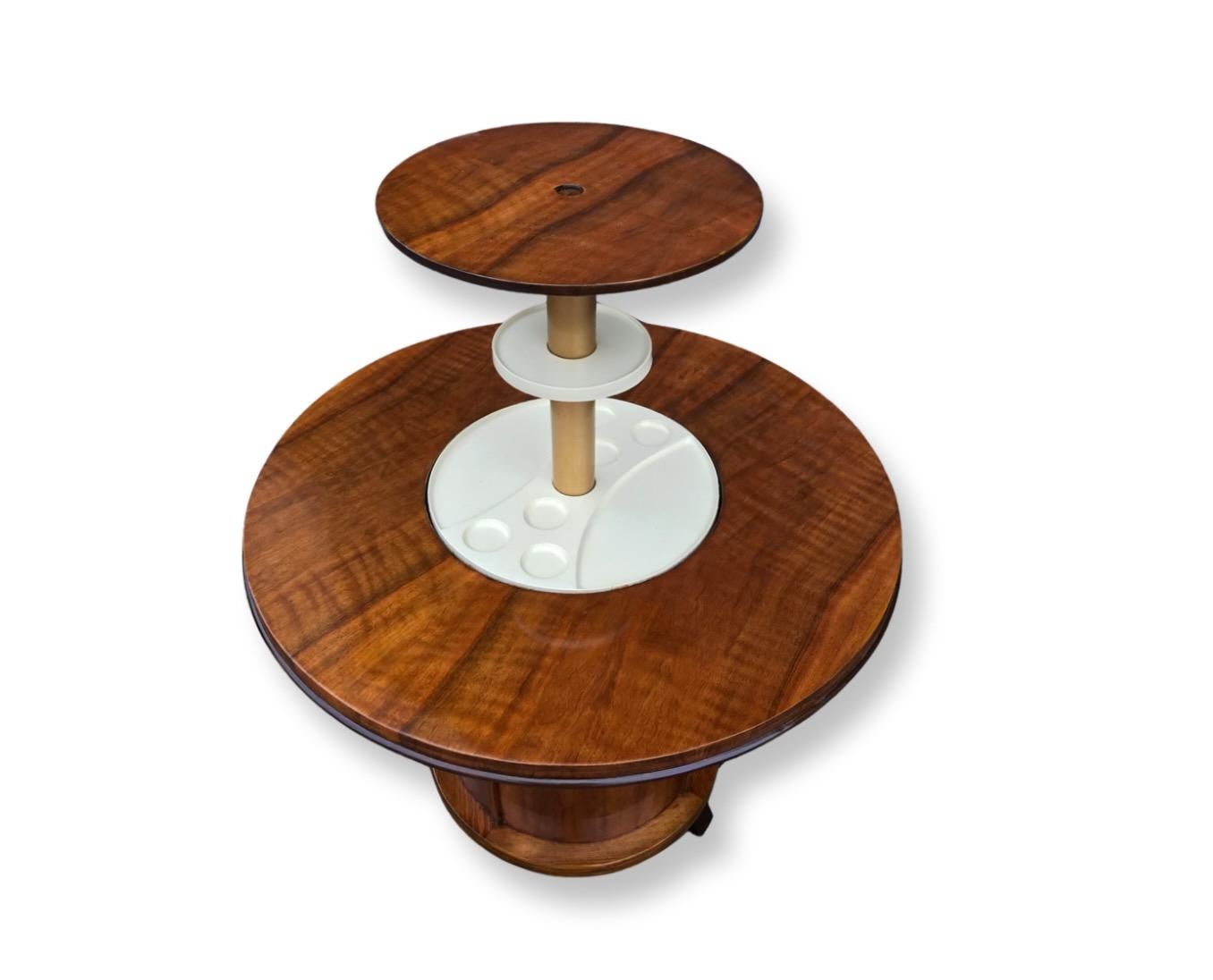 A stunning and rare Art Deco pop up cocktail table, dating to circa 1930,  in striking figured walnut, a lovely warm mellow tone. In excellent condition, the mechanism of this beautiful table works by simply pressing a central button found in the