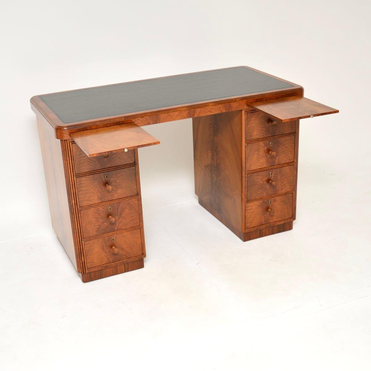 A superb Art Deco figured walnut pedestal desk, made in England and dating from the 1930’s.

This is of amazing quality, it is beautifully constructed from solid and veneered walnut. It is very study and heavy for its size, there is beautiful