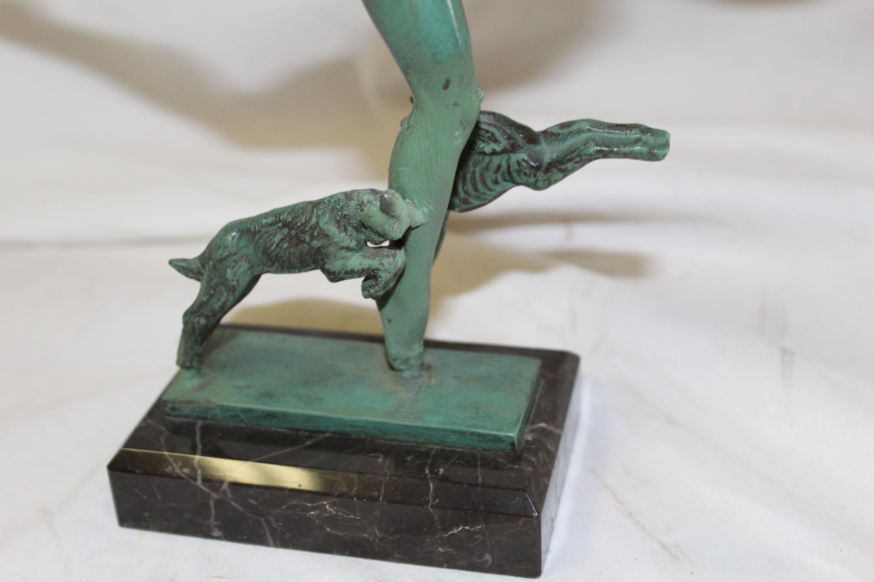 An Art Deco sculpture from the Max Le Verrier collection in France. Has the original green patina finish. Mounted on a marble base 4