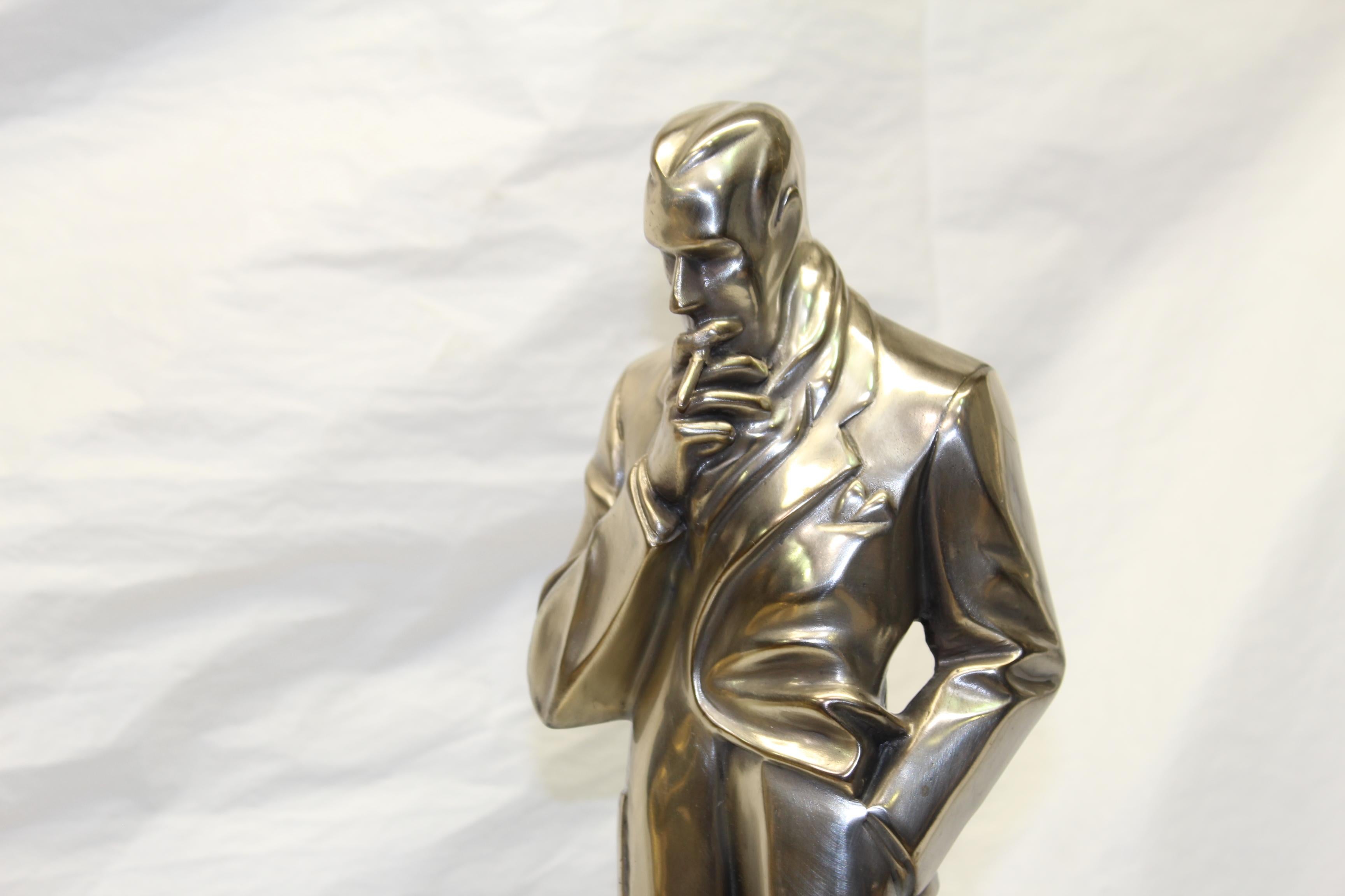 Most famous figurine designed by J C leyendecker illustration artist. Cast in lost wax bronze with polished Antique silver patina. Good size mounted on an absolute black marble base. In the open domain. This item will require white glove packing and