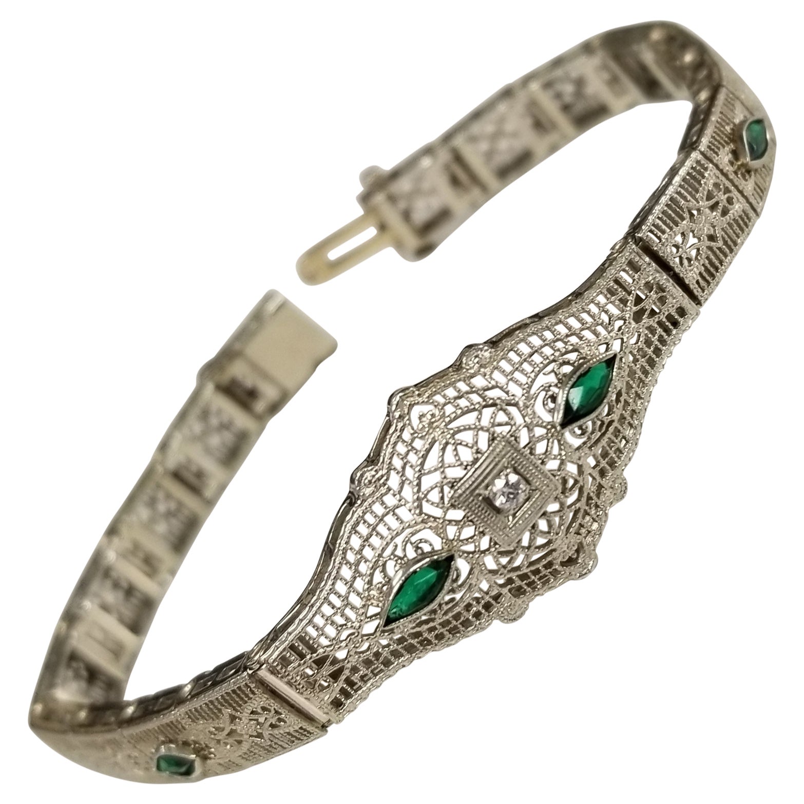 Filigranes Art-Déco-Armband „Belly“ aus 14 Karat Gold mit Diamanten und Smaragden