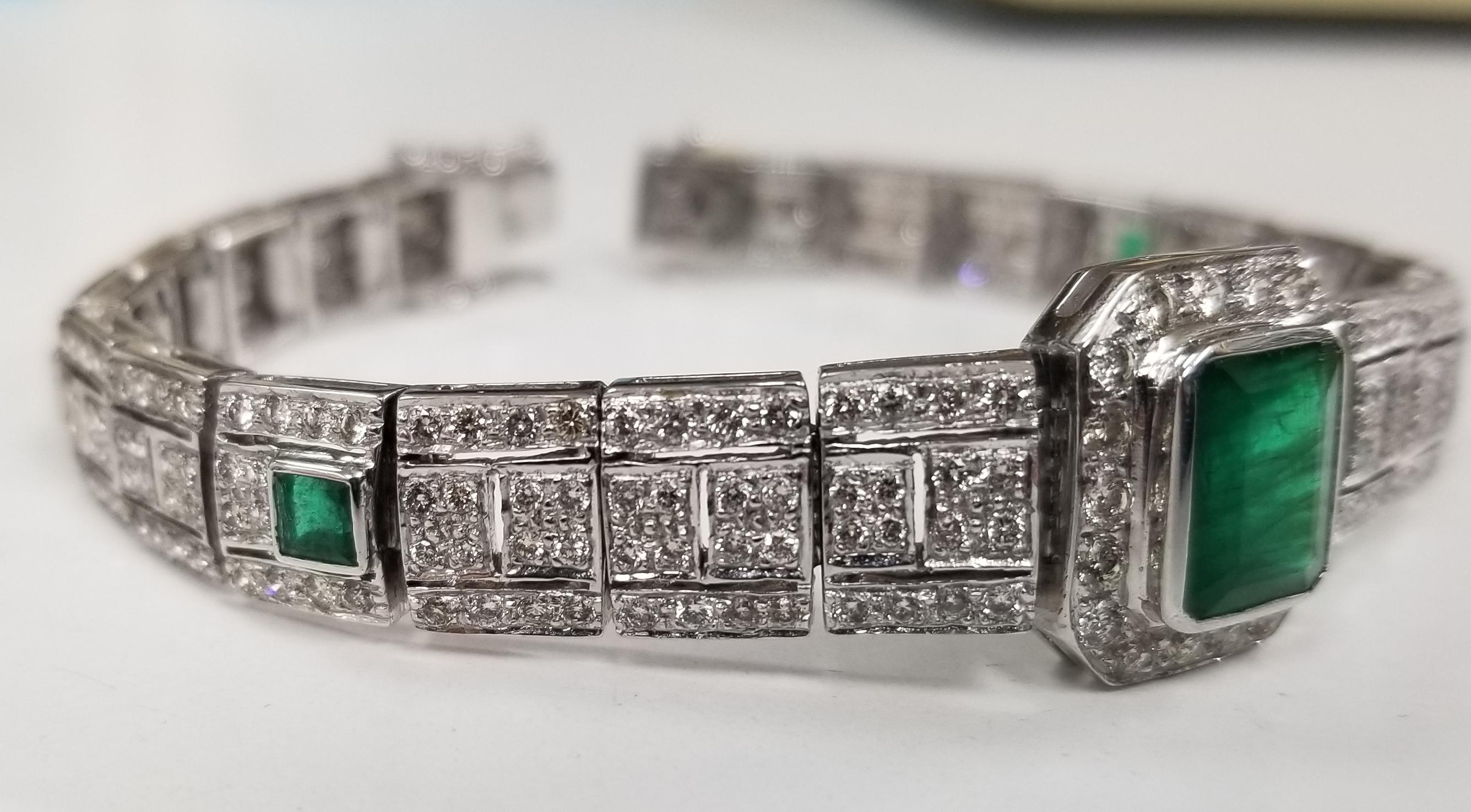 Beautiful women's Art Deco Style filigree bracelet in 18k white gold. This bracelet features 1 emerald cut emerald and 4 square cut emeralds with diamonds .  The bracelet has a solid clasp and safety. 
Specifications:
    main stone: EMERALD CUT