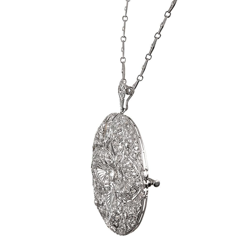 An awe-inspiring art deco original, showcasing all of the detail beloved by devotees of this celebrated jewelry era, this large pendant measures just over 2 inches in diameter. The hand-pierced filigree pattern will dazzle you as you note the