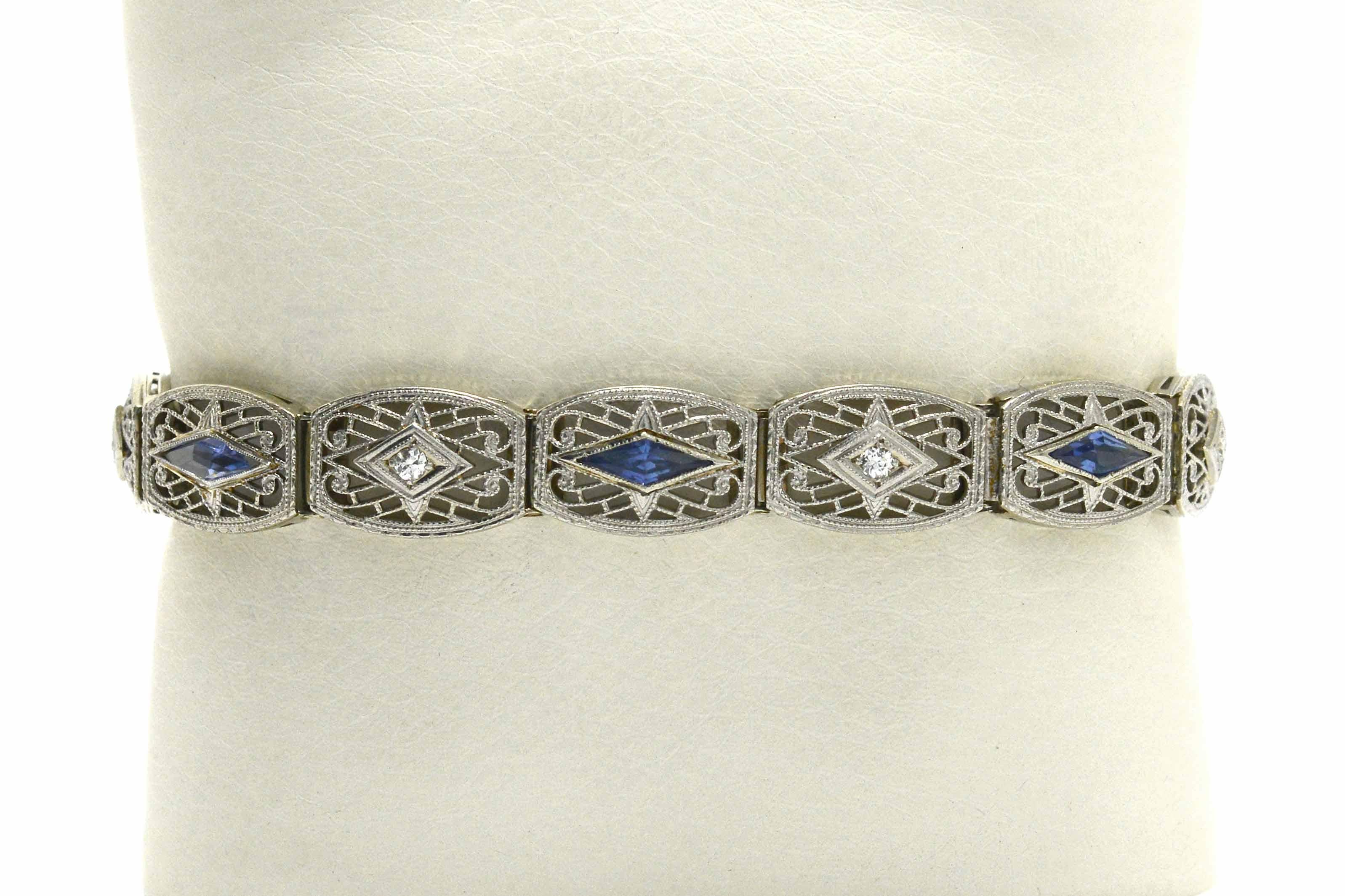 An eminently wearable Art Deco filigree diamond sapphire bracelet. Worn solo, it makes a statement and can be stacked or layered with others for a fashionable look. A Circa 1920s vintage estate heirloom, a work of wearable art from a bygone era. A
