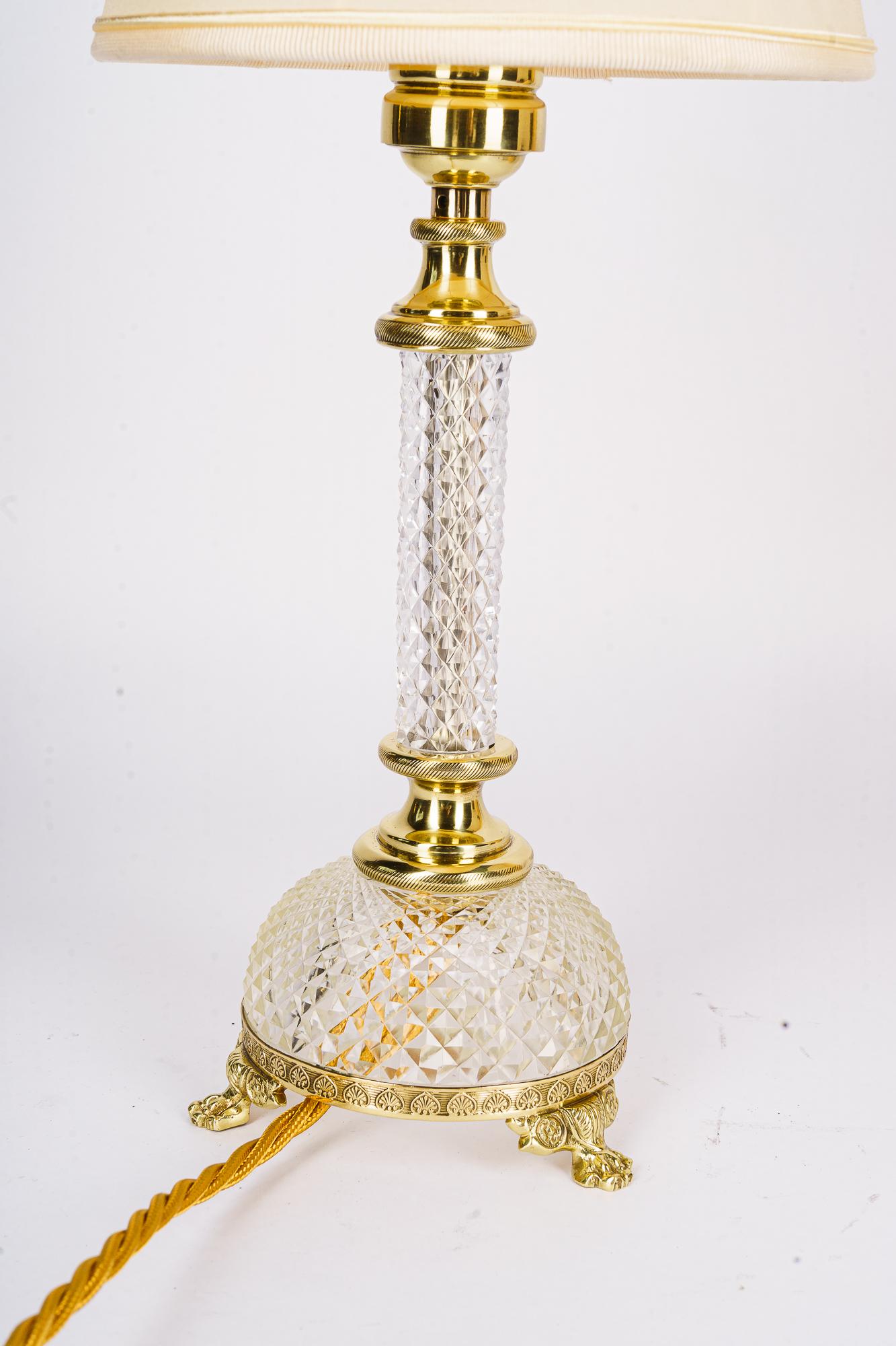 Art Deco fine cut glass table lamp with fabric shade vienna around 1920s
High quality work
Brass polished and stove enamled