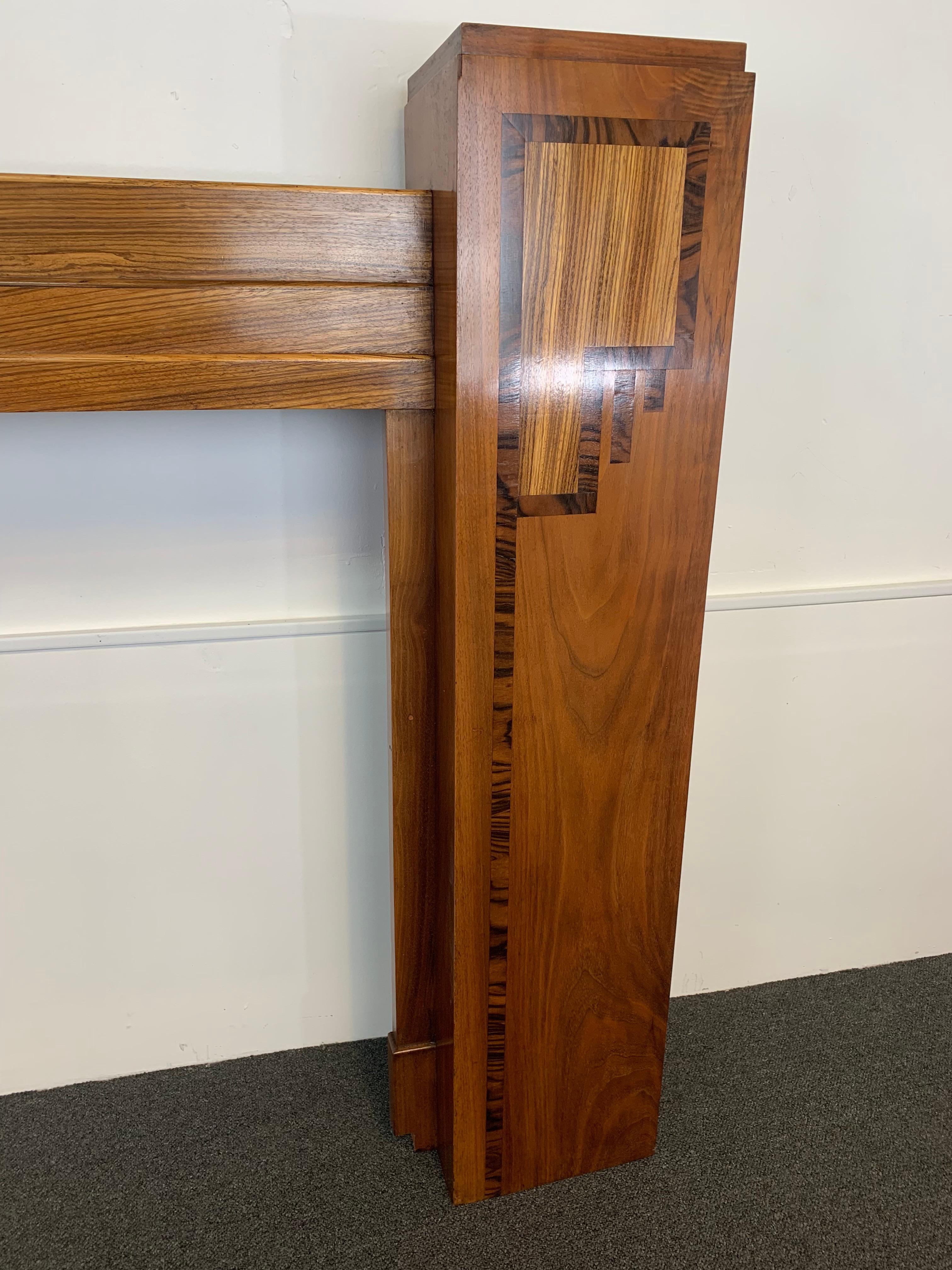 A superb quality abstract fire surround, from the Art Deco era.
Made of different woods, including oak, two types of walnut and calamander.
Beautifully constructed to shown Art Deco detailing, in both raised and inlay of woods.
A striking focal