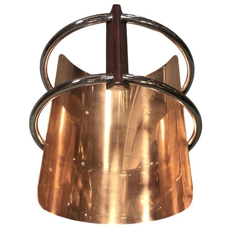 Porta ceppi Art Deco (può essere un portariviste) in cromo brillante, rame e legno di Leslie Beaton per la Revere Brass and Copper Company di Wood, New York, circa 1937.

Conosciuto come 