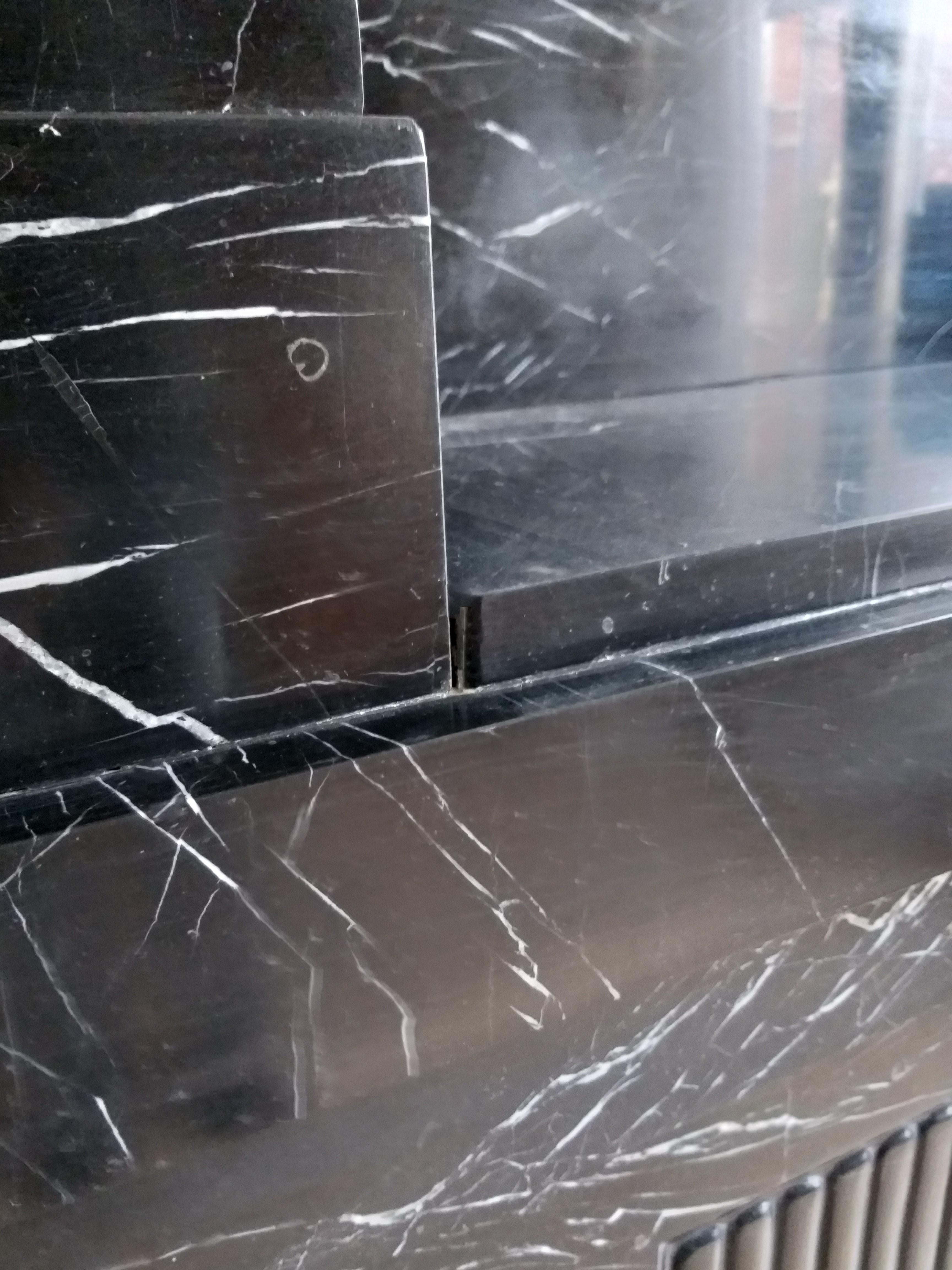 nero marquina marble fireplace