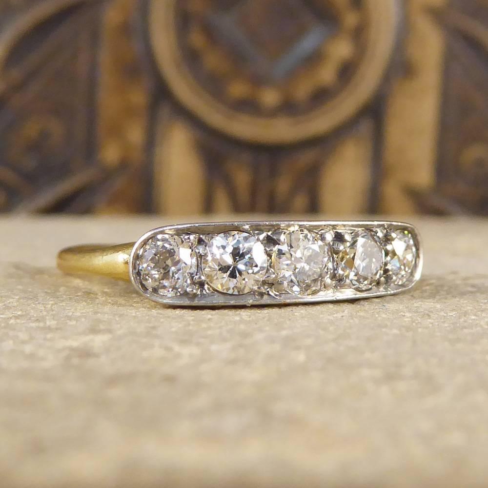 This gorgeous sparkle five stone ring is set with five Diamonds very slightly graduating in size with the centre stone being marginally larger. The Diamonds are in a Platinum and 18ct Yellow Gold closed setting with detailing on the side gallery.