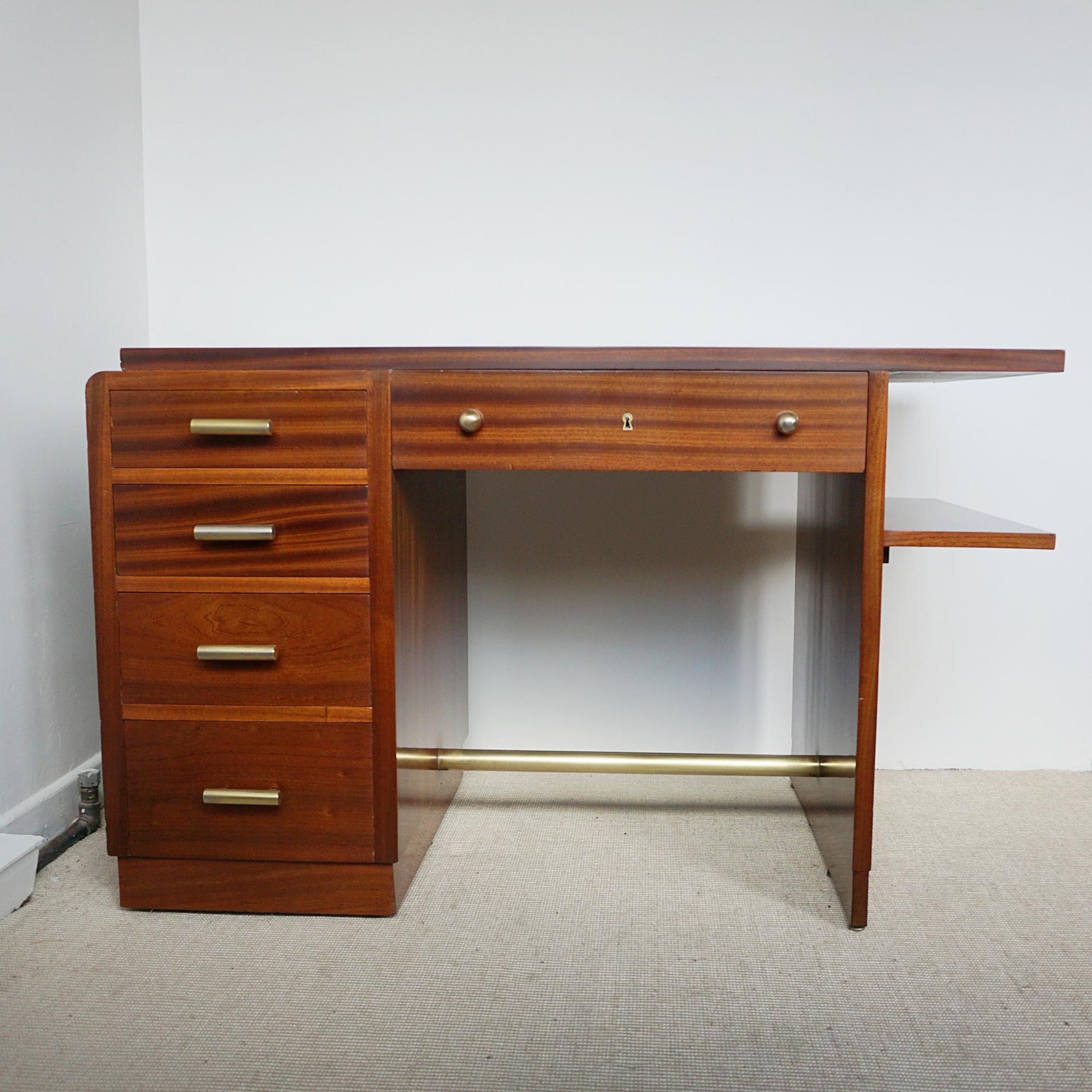 An Art Deco Flame Mahogany Desk. Five pull out drawers with an open bookshelf to side. Original brass handles and stretcher. Wear consistant with age.

Dimensions: H 76cm W 120cm D 64cm 

Origin: English

Date: Circa 1935

Item Number: 2003244

All