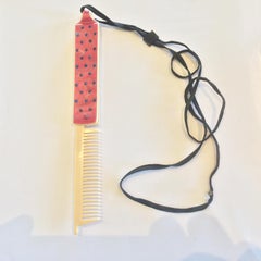 Art Deco Flapper Celluloid Pendant set with rhinestones with a comb built in