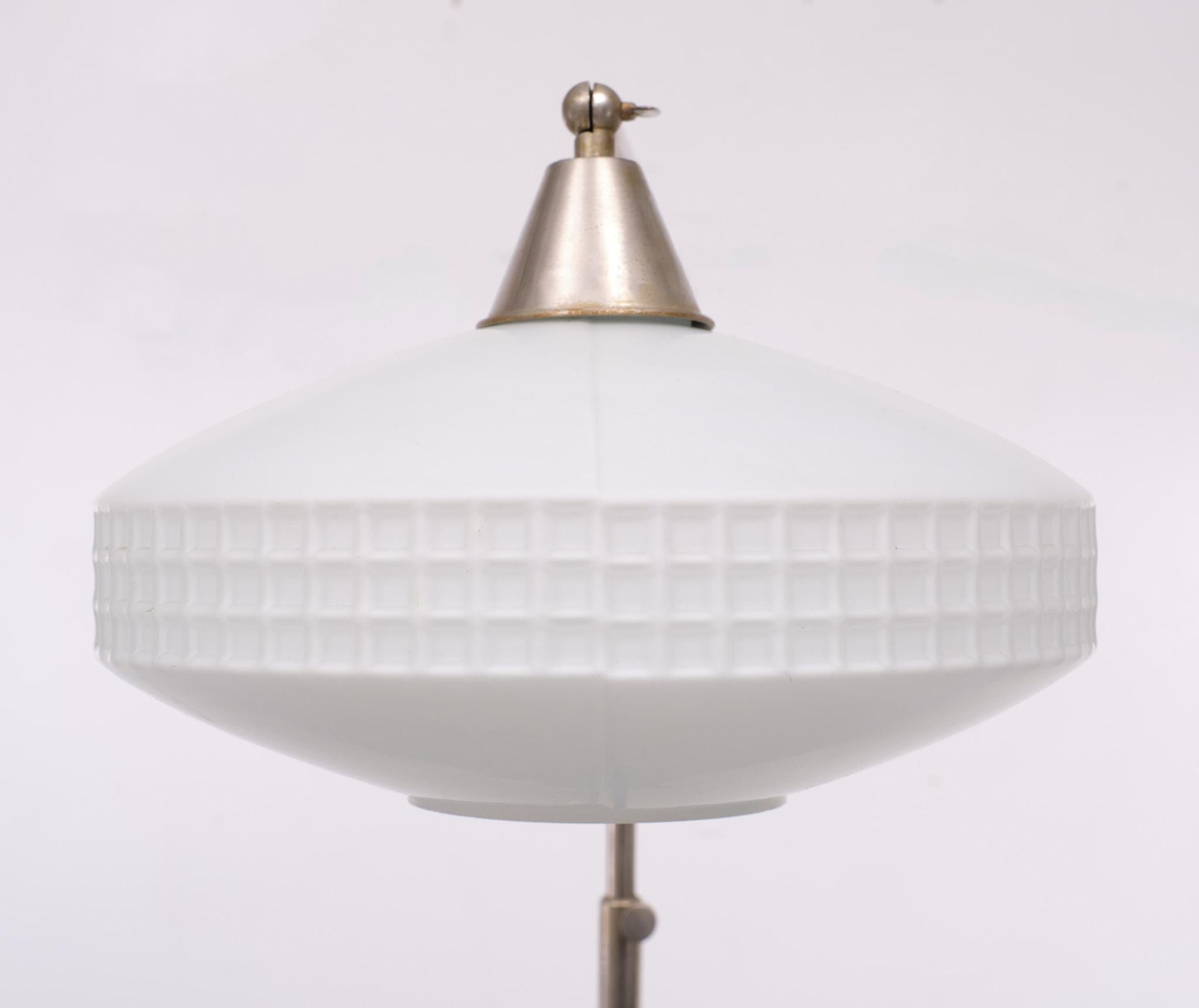 Very nice Art Deco floor lamp . Adjustable in height, nickel.
Still together with its original Opaline Glass shade, switch on the feet   .1930/40 Holland 

Please don't hesitate to reach out for alternative shipping quote
           