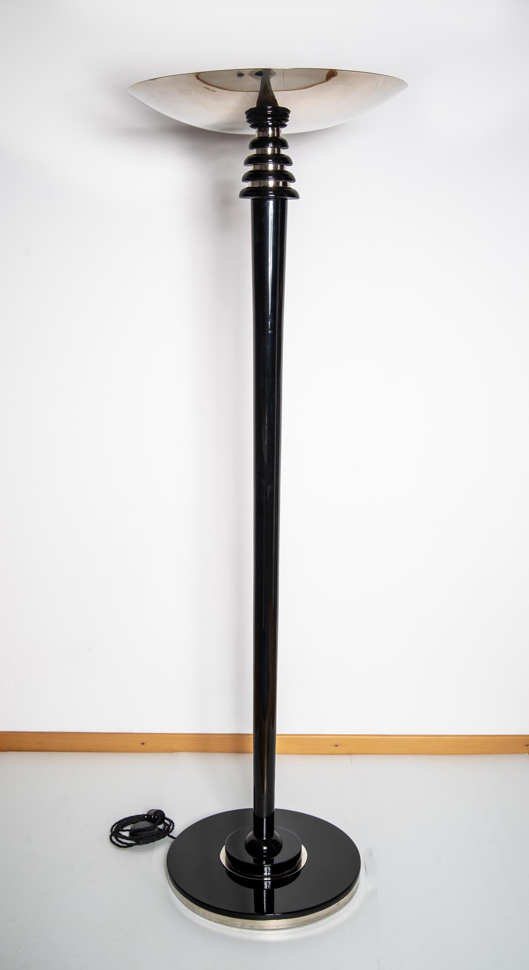 Original Art Deco floor lamp from Paris, circa 1930-1940

Greatly restored condition.
Wood: Black piano lacquer coated and polished.
Polished and nickel-plated brass fittings.
Newly electrified, LED based, dimmable.