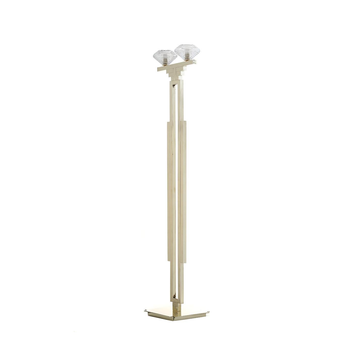 Inspired by the bold and stylish art deco designs, this elegant floor lamp will enrich any room in the house with its timeless allure and minimalist silhouette. The metal structure is welded and brushed by skilled craftsmen in a series of pure
