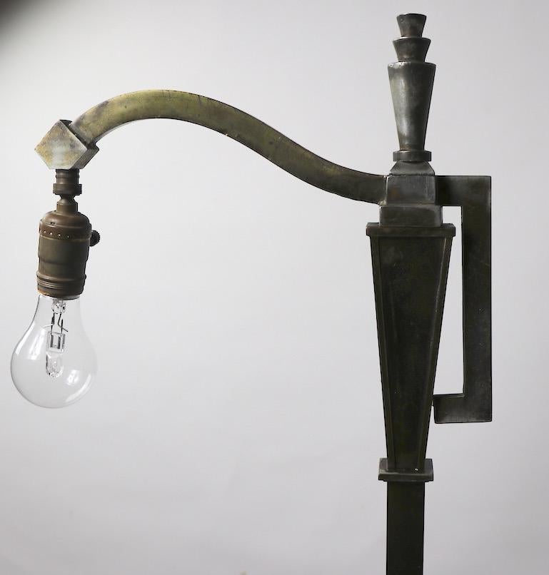 Early Art Deco bridge, floor lamp. This example shows significant wear to the finish, as well as minor splits to the base as shown. Working condition - Accepts standard screw in bulb. Length of arm 12 inches, base 10.25 x 6.
