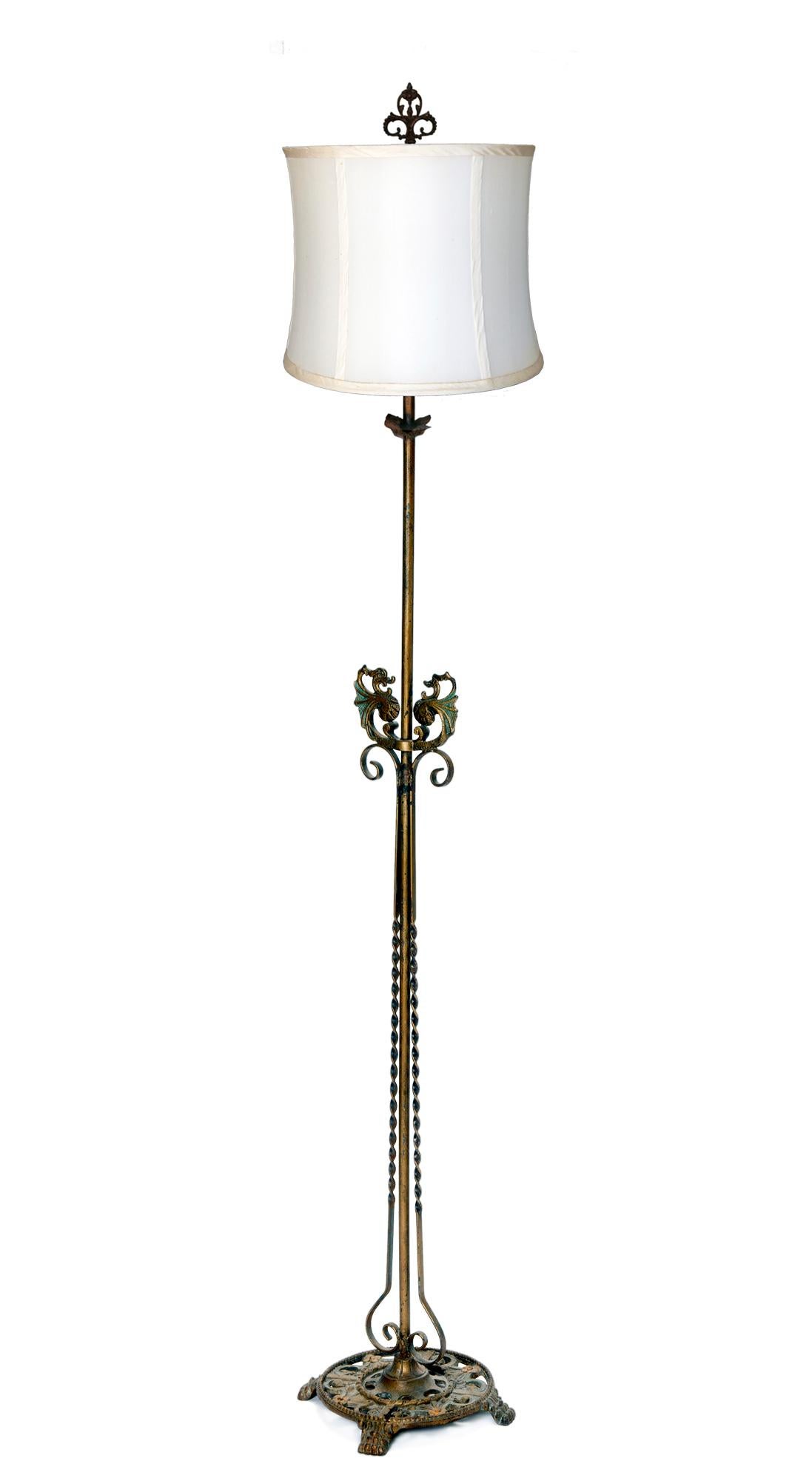 Classic 1920’s wrought iron Deco floor lamp. All original surfaces. Re-wired, brass sockets, standard US bulbs recommended. Lamp has pull chain for two directional sockets. Period silk shade.