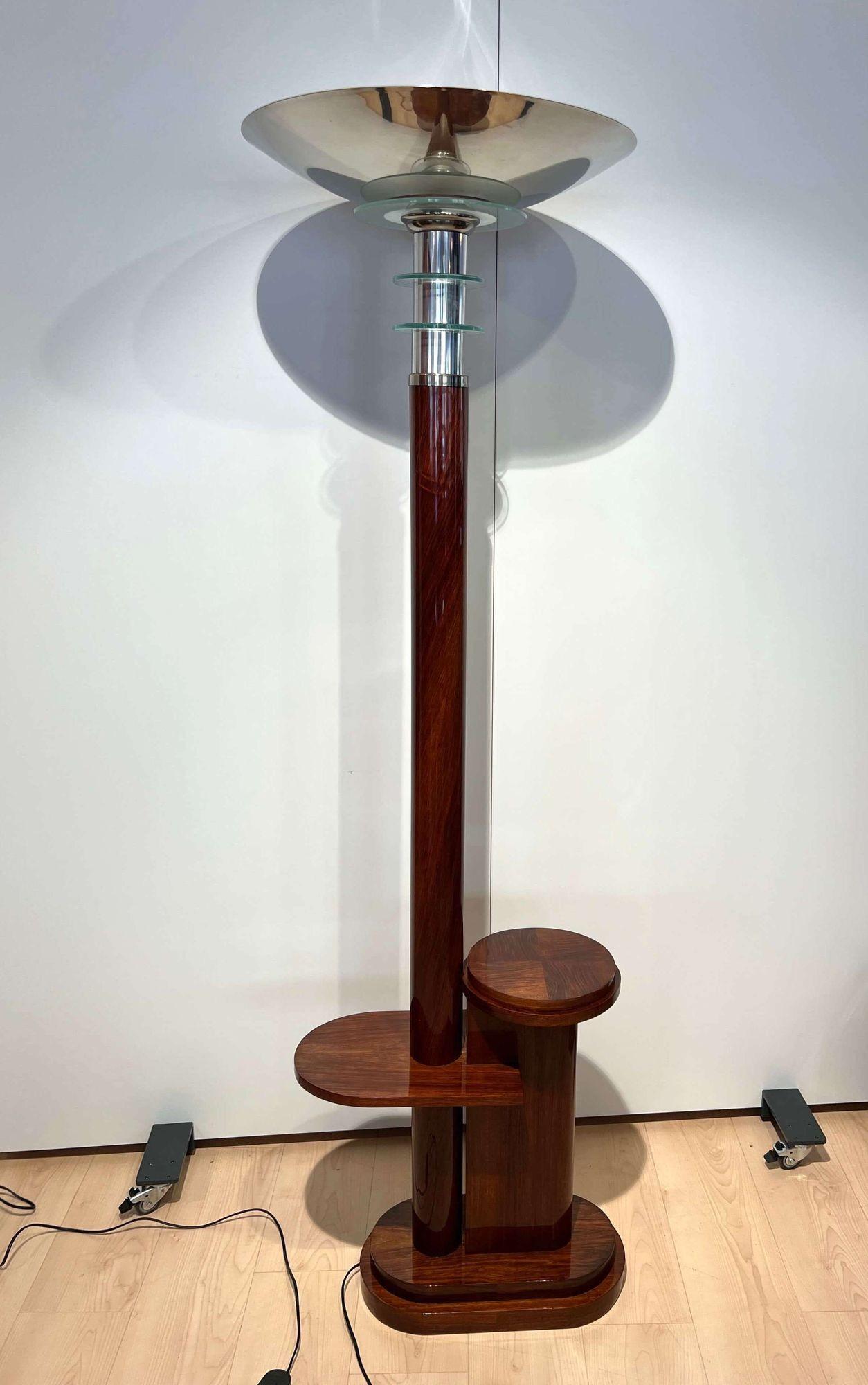 Art Deco floor lamp with side table from France about 1930.
 
Walnut veneered and solid, hand polished with shellac
 
Original chromed shade. Chromed cuff and decorative glass circles in clear and frosted glass.
Long cable with floor switch and