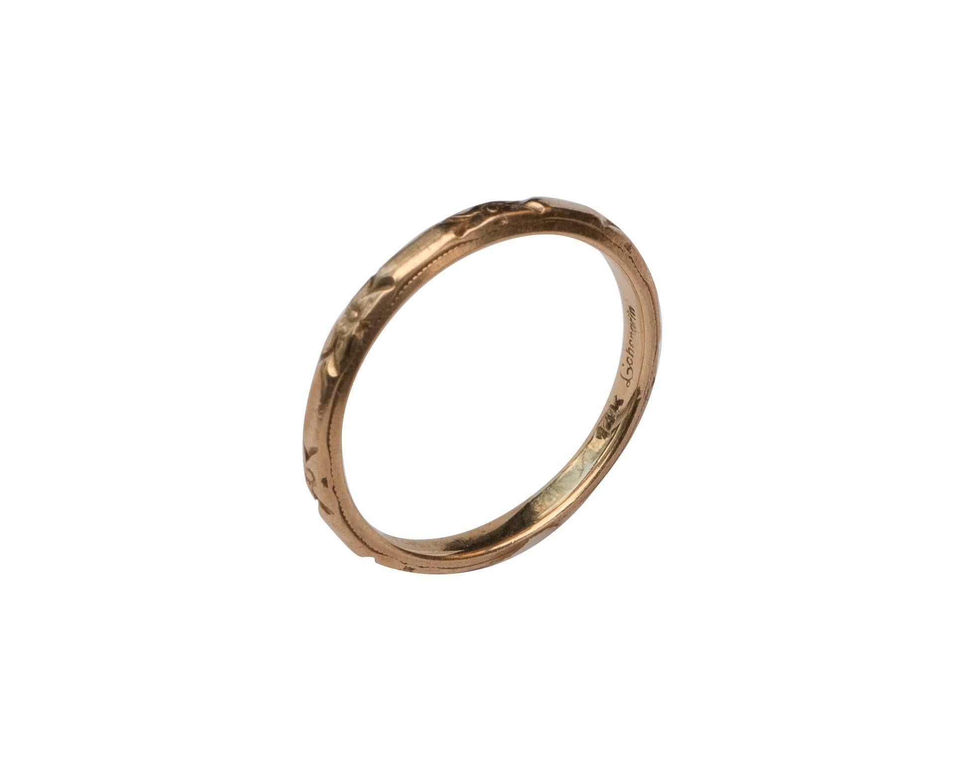 This piece is a genuine Art Deco 1930's yellow gold Lohengrin wedding band! This beautiful dainty band is an excellent example of the early 20th-century style! Likely from the 1930's this Art Deco beauty features a floral carved design all of the